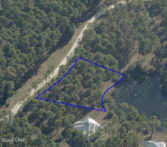 Been waiting for a pond-front Lot in the gated, waterfront community of RiverCamps to build your dream home? I've now got one, it's .66 acres, it is fantastic and it is priced to sell at $150,000. Bring your own designer and builder or listing agent can assist putting you in touch with a builder who knows RiverCamps.
Discover the best kept secret in Panama City Beach. RiverCamps is 1500 acres, gated, surrounded by West Bay, Intracoastal Waterway, Crooked Creek and a 30-minute boat ride to the Gulf. RiverCamps is a nature preserve and will have less than 450 homes when completed with 1000 acres dedicated to conservation. Designed for the outdoor enthusiast there are over 7 miles of connected trails and boardwalks. A community boat ramp, dry boat storage, day use boat slips and washdown stations. Wildlife galore. New pool and pavilion. Basketball and pickleball courts and a new fitness center under construction and expected to be completed late 2026. Outside the gates of RiverCamps you are 10 miles from the famous sandy beaches, 10 minutes from the NW Florida Beaches International Airport, 10 minutes from the new FSU Tallahassee Memorial Healthcare, medical campus and soon to be completed 180 bed hospital and 2 miles from the under-construction Publix grocery, opening early 2027 and the planned 500,000 sq ft of adjacent retail space! RiverCamps is truly close to everything yet far from the traffic and crowds.