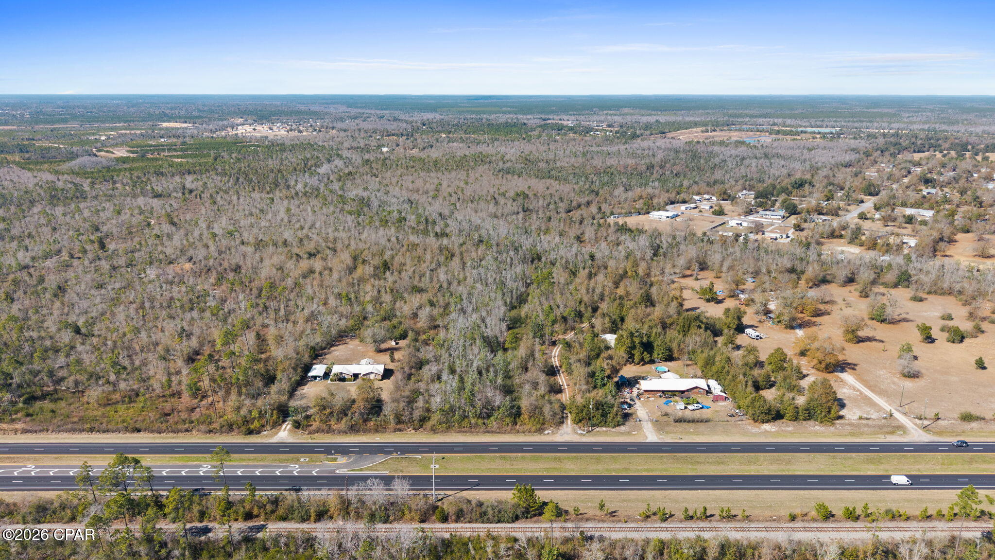 Opportunities like this don't come around often. This expansive ±93-acre tract offers a rare chance to secure a large footprint along a well-traveled corridor with substantial frontage and outstanding visibility. With the majority of the property currently zoned for commercial use, the groundwork is in place for a wide range of potential development concepts, investment strategies, or long-term holds.

The acreage stretches deep, providing flexibility for phased projects, mixed-use possibilities, or strategic land banking. Portions of the property may include low-lying areas or natural features, offering character and potential for creative site planning. Buyers are encouraged to conduct their own feasibility studies, surveys, and due diligence regarding zoning, wetlands, utilities, and intended use.

Positioned near established residential pockets and growing activity, this location offers both accessibility and room to build something significant. Whether you're looking to expand your portfolio, develop at scale, or secure a prime piece of land in a path of growth, this is a tract that demands attention.

Large acreage. Strong exposure. Serious potential.