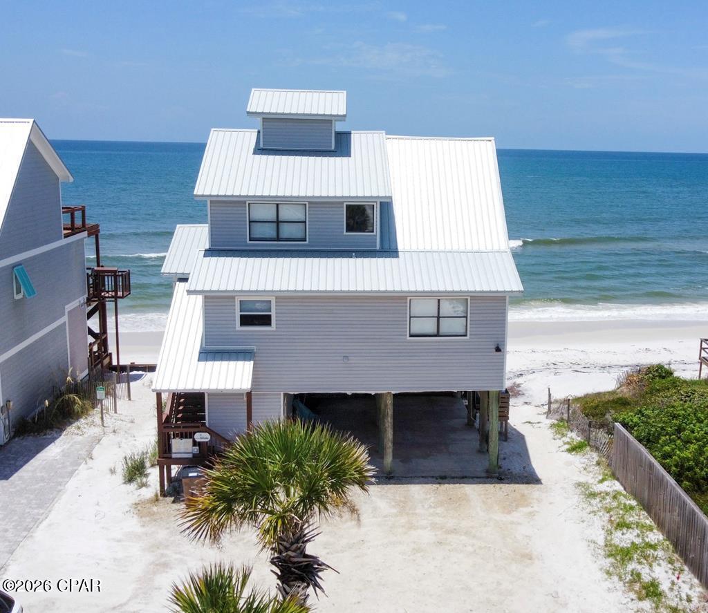 Welcome to this turnkey Gulf-front retreat located on the highly sought-after North Cape San Blas coastline. Offering 60 feet of direct Gulf frontage, this beautifully maintained 4-bedroom, 2-bath home delivers the perfect blend of coastal charm, investment potential, and unforgettable beachside living. Designed for both relaxation and entertaining, the home features an open-concept layout filled with natural light and stunning Gulf views. Spacious living areas flow seamlessly onto expansive outdoor decking where you can enjoy breathtaking sunsets, coastal breezes, and direct access to the sugar-white sands of the Forgotten Coast. This property has an established rental income history with repeat guests and excellent vacation rental performance, while still providing flexibility for personal use with family and friends throughout the year. Whether you're searching for a primary residence, second home, or income-producing investment property, this home checks every box. Ideally located near the State Park, bike path, boating, fishing, and local dining, this property offers the ultimate Cape San Blas lifestyle in one of the area's most desirable beachfront settings. **Updated Photos Coming Soon**