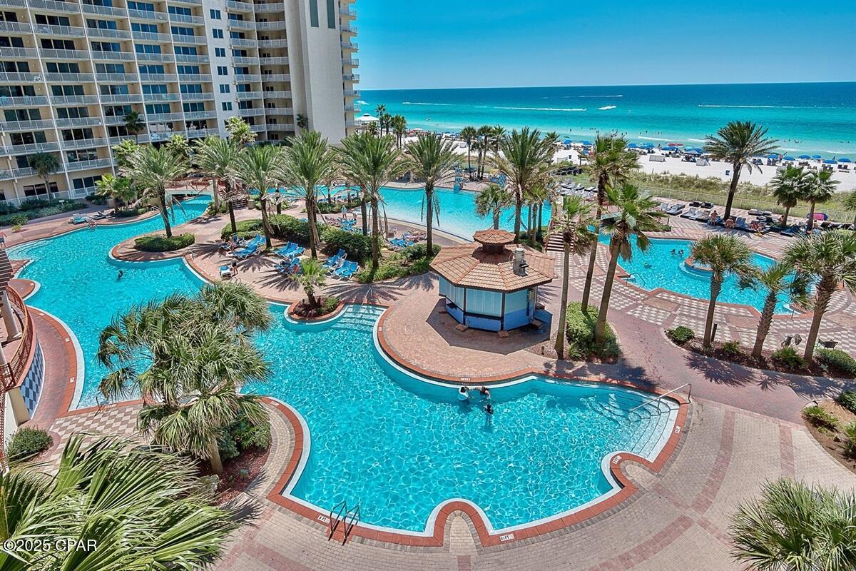 CURRENTLY UNDER CONTRACT, SELLER WILL CONSIDER BACKUP OFFERS

Gulf-Front Primary Suite
Strong Rental Income
See Walk-through Video

Enjoy breathtaking Gulf views through floor-to-ceiling glass doors leading to the balcony from both the living room and the Gulf-front primary suite. This spacious 2-bedroom + bunk room, 2.5-bath floor plan lives and rents like a true 3-bedroom condo.

Major exterior improvements at the resort are nearing completion, and construction on this stack is already complete, making this unit ready for immediate enjoyment and rental income.  

Comfortably sleeping 8 and including a reserved parking space, this condo is being sold fully furnished and rental-ready. Recent updates include flooring, furnishings, paint, appliances, granite countertops, and washer/dryer.

The property has a strong history of 5-star guest reviews and generates approximately $50,000 in annual gross rental revenue.

Located in the highly sought-after Shores of Panama, owners and guests enjoy:

• 500 feet of Gulf frontage
• 14,000 sq. ft. lagoon-style pool
• Heated indoor pool, hot tub, sauna, and steam room
• Fitness center
• On-site dining, tiki bars, coffee shop, and gated security

Conveniently located in the heart of Panama City Beach near shopping, dining, and attractions including Ripley's Believe It or Not! Panama City Beach, WonderWorks Panama City Beach, Shipwreck Island Waterpark, and Pirates Voyage Dinner & Show.

Whether you're seeking a beachfront getaway, second home, or turnkey investment opportunity, this condo offers outstanding views, resort amenities, and proven income potential.

See Documents section for additional details. Buyer to verify all information deemed important.