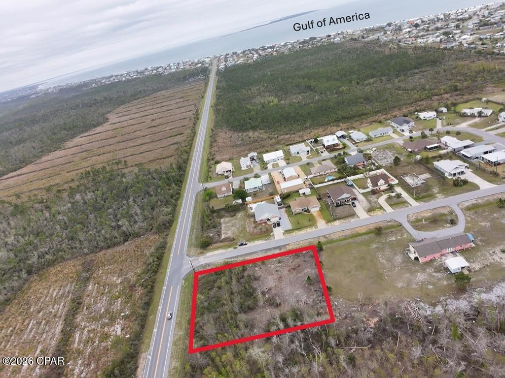 One Acre lot located on the corner of CR 386 and 15th St in Mexico Beach that balances buildability with natural privacy. Partially cleared. Survey shows .44 Acre uplands and .56 Acre Wetlands. There is a generous buildable footprint plus a tranquil natural backyard. Residential zoning. Tap Fee Due. Water, Sewer and Electricity available. Mexico Beach is a Golf cart friendly community and the beach is within half mile. Embrace the low key Mexico Beach lifestyle.
