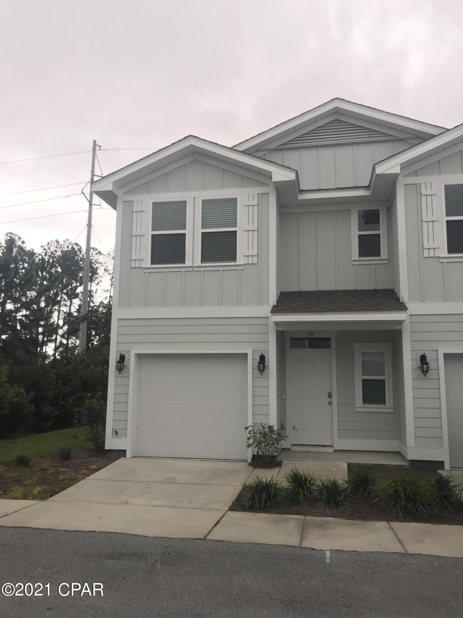 1.4 miles from the beach! This 3 bed 2.5 bath newer town home has granite counter tops and stainless appliances. Downstairs is an open floor plan living, kitchen and dining area with a half bath and a one car garage. Upstairs is a large master suite with walk in closet & bathroom with double vanity and tiled walk in shower. Two guest bedrooms, a guest bathroom and a closet with washer and dryer hookup are also upstairs. There is a small open patio out back and open land behind you for a beautiful view. This is an end unit so there is no one beside you and you have more windows. The pool and clubhouse are spacious and include parking. Only one car will fit in the driveway. There is a Smart Home Technology system installed that allows you to program your thermostat Lawn care is provided by the community. There is a dumpster for garbage disposal. Cluster mailboxes are located nearby for mail service. Utilities are the responsibility of the tenant.  $2200 per month and $2500 security deposit.  There is no washer and dryer provided.