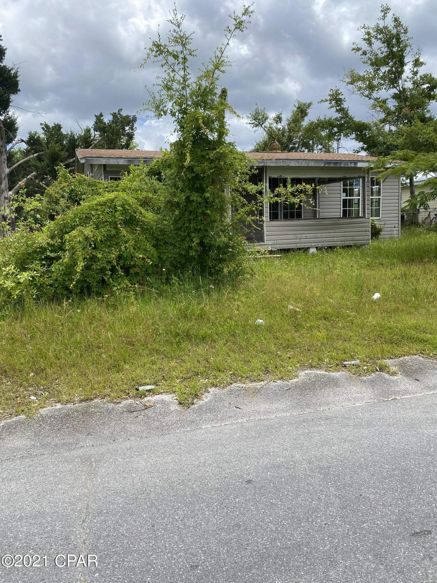 Investor Opportunity** 1/2 acre situated on the corner. Renovate, flip or buy and hold. This is YOUR opportunity on a spacious lot with existing utility hookups.