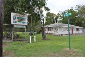 Do not pass up this great deal! SELLER SAYS SELL!!!! Will consider offers! High visibility commercial location on E Business Hwy 98. Would make an indeal home base for your contracting business,repair shop, office,workshop, retail, and many other options. The corner lot size is approx. 50' x 203'. The main building is 1200+ sqft and the two out-buildings each have power. The large Quonset Hut style building is great for shop or storage. The entire property is fenced. Great location for a business. You're just 5 minutes from Callaway/Parker and Tyndall AFB. If you wanted a deal for your business location this is it! All info is approx and must be verified by Buyers if important.