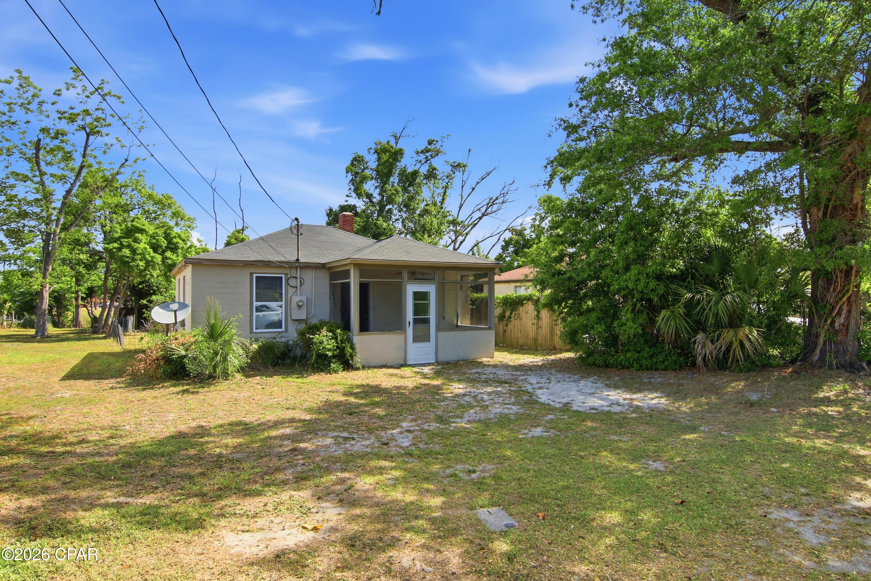 Clean and move in ready. A screened-in porch welcomes you inside to the living area; with the kitchen located to the right and two bedrooms and a bathroom are located to the left. The layout is simple and functional. Priced with today's market in mind, this home is full of potential. An ideal opportunity for a first-time buyer or an investor looking to add to a rental portfolio.