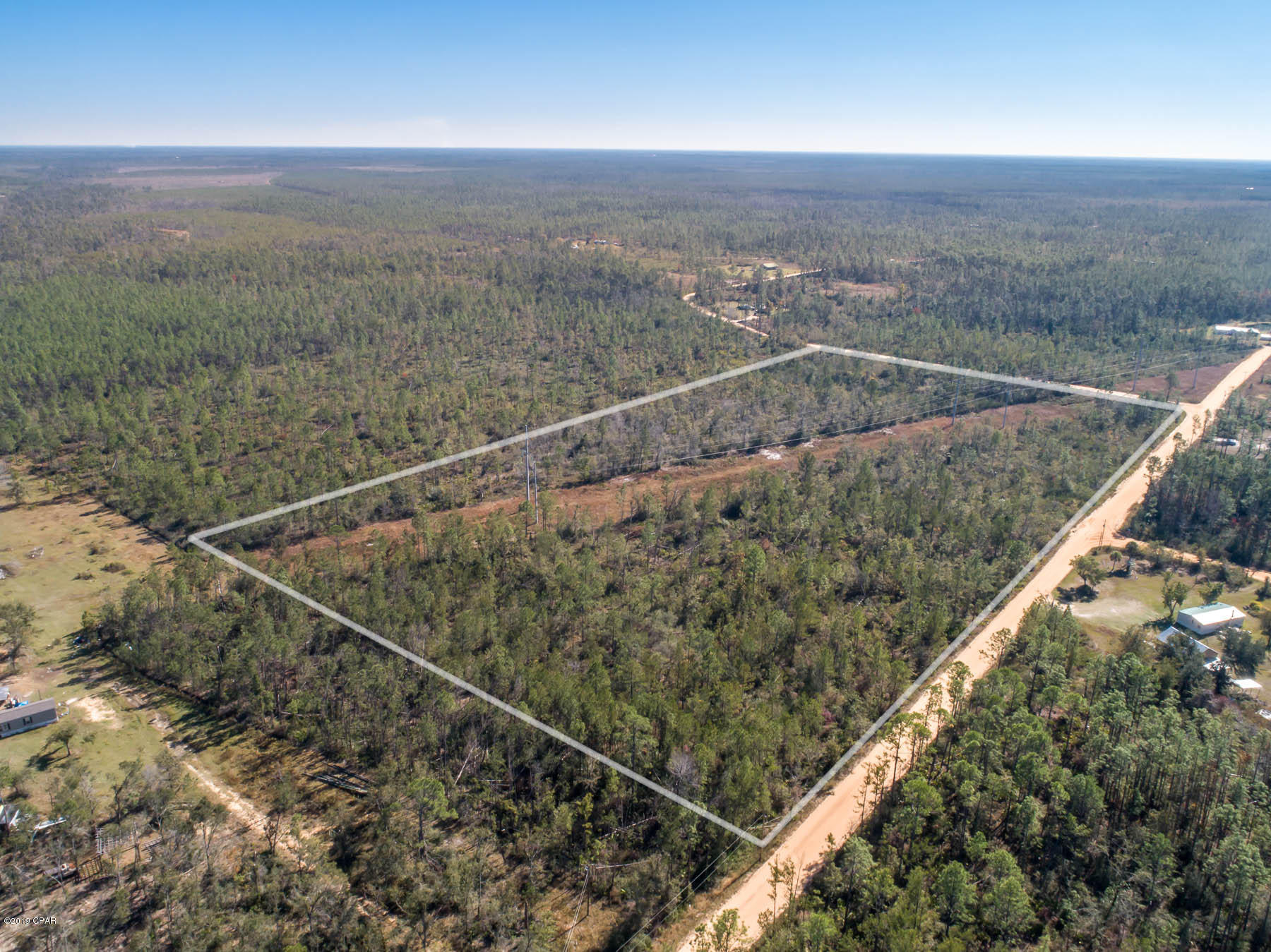 Fantastic 18.32 acre property perfect for your new dream home! Great for hunting or a ranch an a large secluded property with easy access from a well maintained clay road. Easy drive to Panama City and Northwest Florida Beaches International Airport. There is an Gulf Powerline easement running through the property.