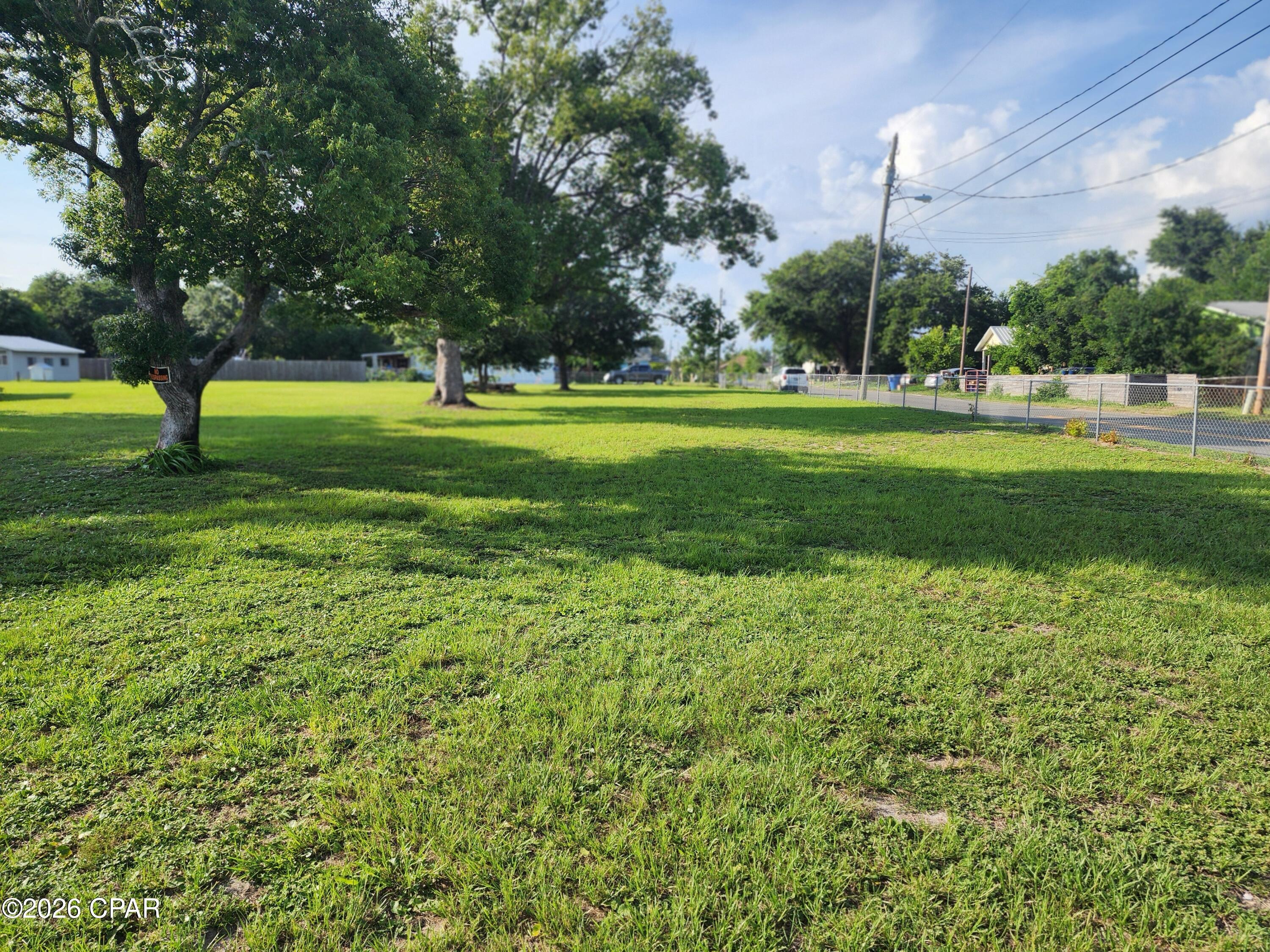 Gorgeous lot to make your new home. Large oak trees, corner lot and a patio area already built with a swing to sit out and enjoy your morning coffee. Conveniently located close to schools, shopping, hospitals and not far from the World's most beautiful beaches. This lot is zoned R2 multi use. See MLS # 791909 to see other opportunities.