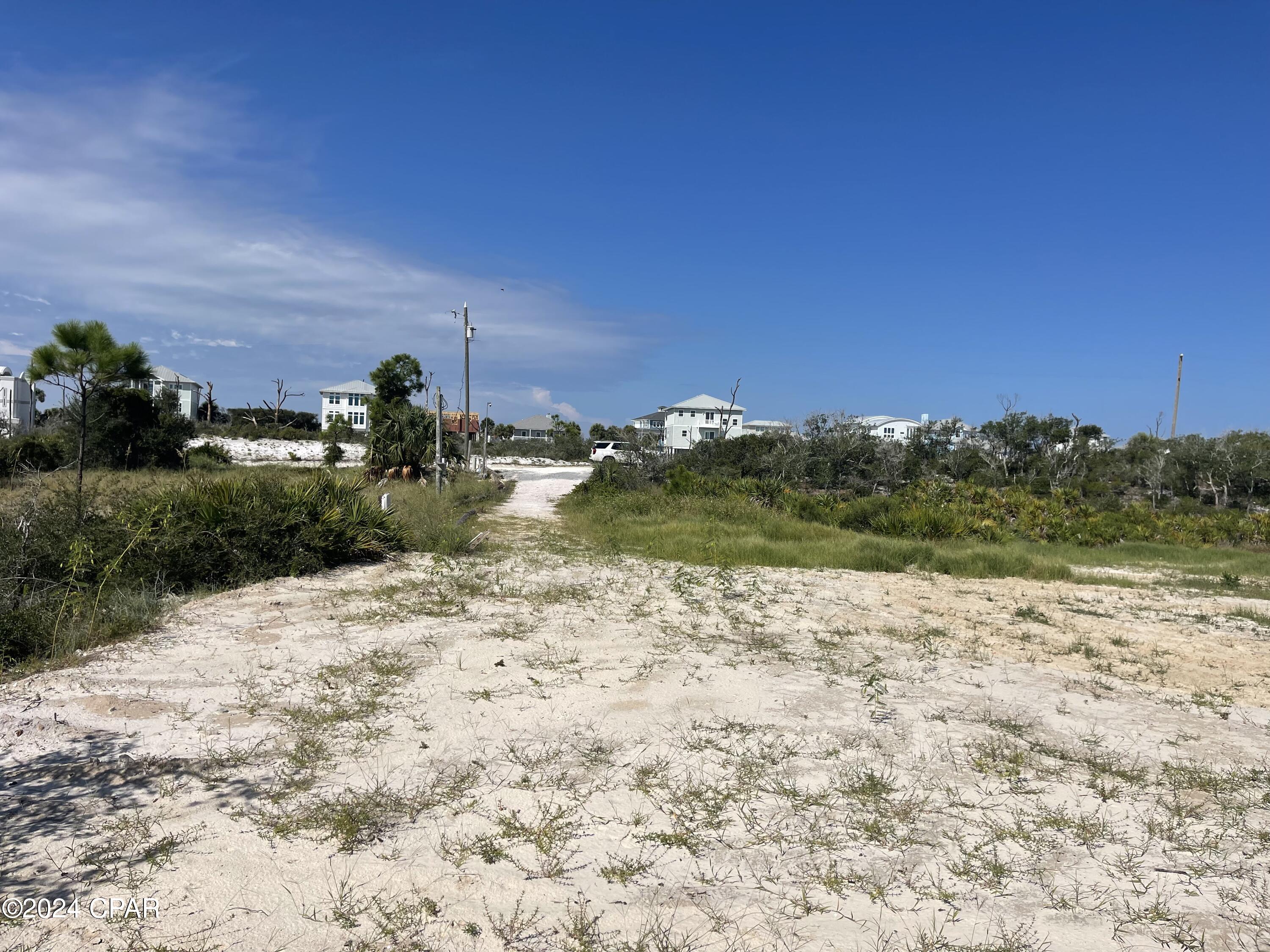NORTH CAPE SAN BLAS BUILDING SITE WITH POSSIBLE OWNER FINANCING!!! Located less than 80' from the state park with NO HOA or HOA FEES! Dedicated beach access with a boardwalk/dune walkover that meanders between beautiful old growth coastal oaks and palms. This elevated, platted, and vested lot at The Bluffs at Secluded Dunes affords views of the Gulf of Mexico to the west, a 4.5 acre wetland area to the rear, St Joseph State Park views to the north. Possible views of the bay as well depending upon elevation of home. Water tap already paid for and installed, city sewer available, electricity already on site. Site already is cleared and prepped with driveway installed. Get back to nature today! All dimensions were obtained per the recorded plat or the GulfPA site. Please verify if important.