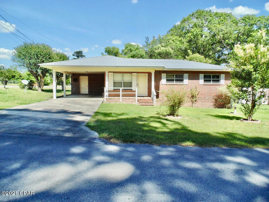 JUST WHAT YOU'VE BEEN LOOKING FOR! Budget-friendly 2 BR/1 Bath brick home with metal roof & concrete slab sitting on a corner lot in the Bonifay city limits. The house features a carport with storage room and a sunroom off the back of the dining area that could be used as a 3RD bedroom or office. There is an inside laundry space right off the dining area. The HVAC was  updated in 2017 & the roof was installed in 2012! A few cosmetic updates would make this home a buyer's delight.