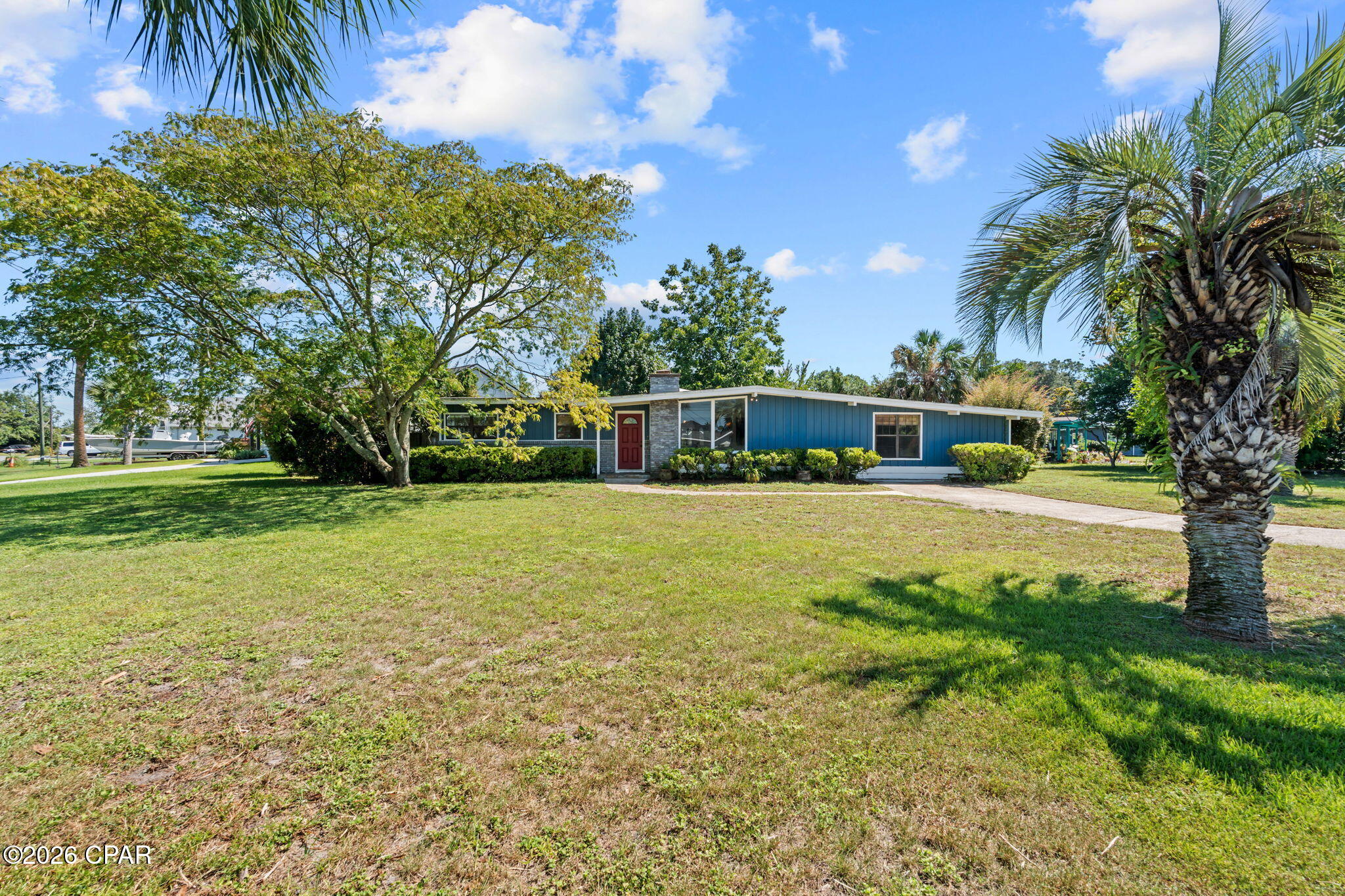 Solid brick home, even better neighborhood, and a great opportunity in Panama City Beach's established Woodlawn community. Located at 306 Carolyn Avenue, this 3-bedroom, 2-bath home offers approximately 2,012 square feet of heated and cooled living space, plus an additional approximately 350 square feet in the enclosed sunroom/Florida room that is not included in the reported heated and cooled square footage.

Inside, the functional single-story layout includes an open kitchen with breakfast bar, living and dining areas, a dedicated office or study, and flexible bonus space in the enclosed sunroom. The home provides a generous footprint for a buyer looking to update, renovate, personalize, or add value over time.

Situated on an approximately 0.23-acre lot, the property features an established yard with irrigation and room for outdoor entertaining, gardening, pets, or future improvements. The Woodlawn neighborhood adds to the appeal with access to a community public boat launch area, while nearby JDF Marina offers added convenience for boat storage, slips, rentals, and access to area waterways, Shell Island, and the Gulf.

Enjoy a central Panama City Beach location near beaches, boating, fishing, shopping, dining, entertainment, and everyday conveniences. Whether you are searching for a primary residence, second home, renovation project, or Panama City Beach investment opportunity, 306 Carolyn Avenue offers flexible space, boating access, and potential in a desirable established neighborhood.