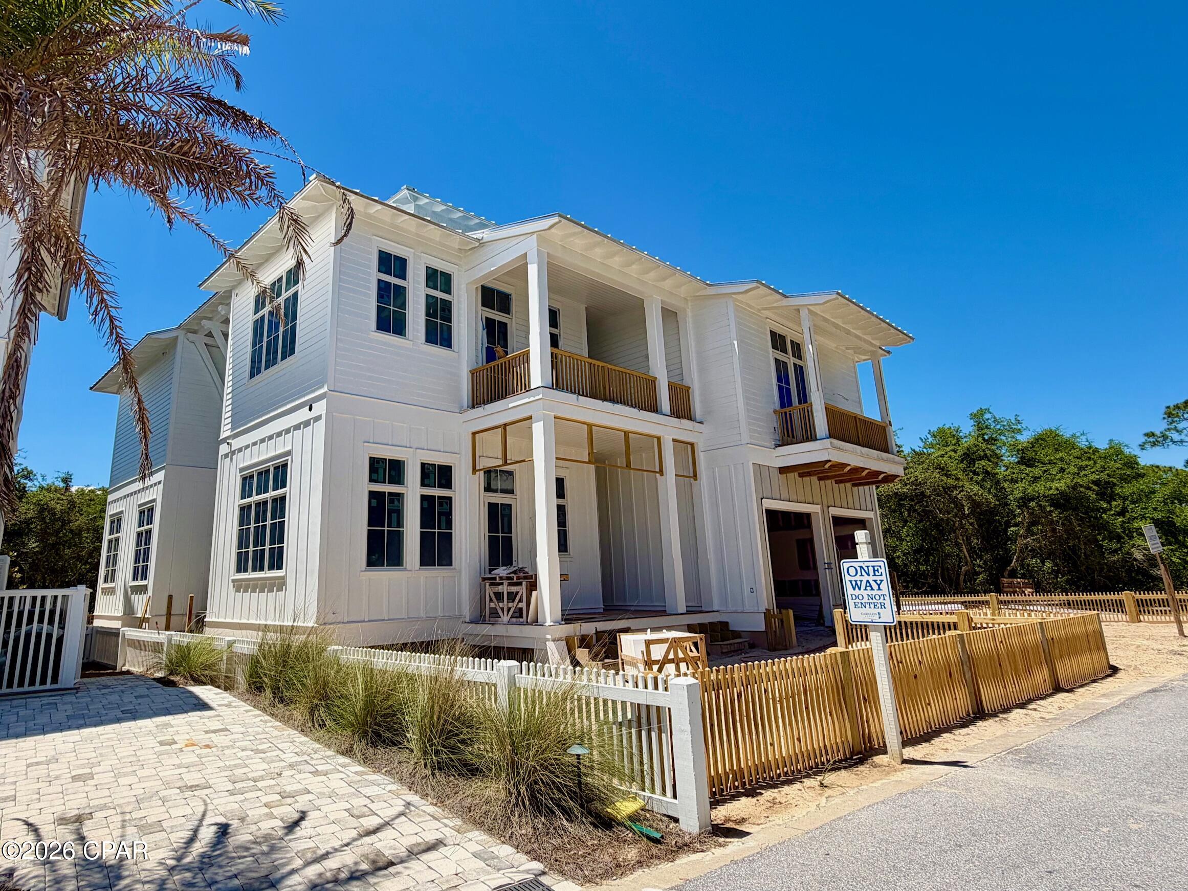 Experience coastal luxury in the exclusive, gated Carillon Beach gulf front community along Florida's renowned Scenic 30A corridor. This newly constructed 4-bedroom, 4.5-bath residence offers a seamless blend of elegance, comfort, and modern resilience--built to meet current Dade County hurricane standards for peace of mind.  Upgraded finishes and appliances are featured throughout the home.

Designed for both relaxation and entertaining, the home features a double garage, two spacious lanais, two living spaces, and a  tower that showcases breathtaking panoramic views of the Gulf and Lake Powell--the largest coastal dune lake in the United States. There is space to add a pool if you so desired.  Enjoy effortless beach access along with the charm of a vibrant town center filled with boutique shops, local eateries, a fitness center, and pilates studio.

Residents benefit from an array of resort-style amenities, including multiple pools, playgrounds, and courts for tennis, pickleball, and basketball--creating the perfect balance of leisure and activity in one of the Florida Panhandle's most sought-after beachfront communities.

Construction is well underway and the home is expected to be completed by late summer 2026.

Don't miss the opportunity to make this home your vacation home, an investment property, or your full time residence.