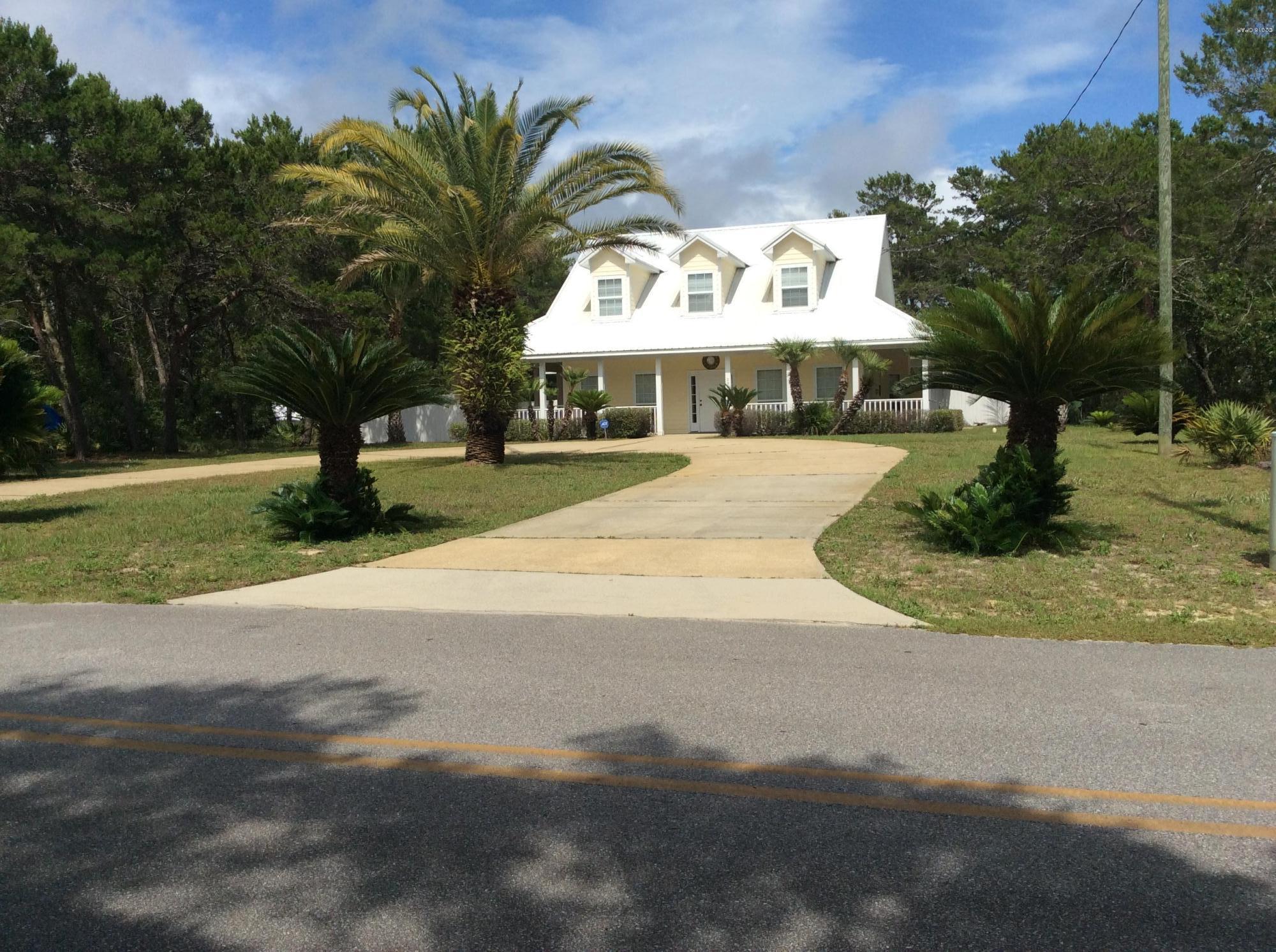 Awesome Home!  Awesome Location!  Private Setting in North Inlet Beach but steps from all that Inlet Beach and 30-A has to offer!  Living, Dining and Master all on ground level.  Master Bedroom leads to the backyard oasis with its Palm trees, HUGE pool and mini outside house for storage/workshop.  Upstairs has 2 large bedrooms plus bonus are perfect for office/den or extra sleeping.  Wrap around porch and extensive landscaping!  Huge rental Potential!  Beach access at the end of Wall street plus Inlet Beaches 19 acre Gulffront Park is at the end of Orange Street.  Wall street is the closest street in North Inlet Beach to 30-A with all its magic but without the congestion!  This is a Must See!  All Dimensions are aprox.
