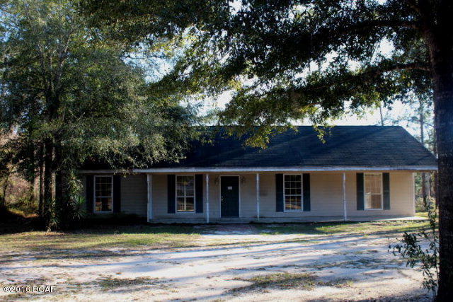 Neat house in Leisure Lakes a gated community with private lakes to be enjoyed by property owners. The home has nice features that include a split bedroom design, a formal living room, kitchen fully equipped and a large covered front porch across entire front of house. There is a storage building included. All of this is situated on 2.5 Acres!!