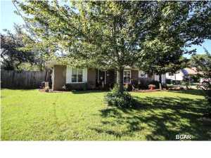 Very nice well kept home located in a quiet neighborhood and on a dead end street, no thru traffic to worry with. Well landscaped yard, extra parking pad for RV or boat. Privacy fenced yard with sprinkler system with lawn pump and yard building as well as nice screened porch. Split bedroom floor plan, master has it's own private bath, living room has a nice corner brick front gas fireplace, cathedral ceilings and dining area just off the kitchen, nice open floor plan. There is ceramic tile throughout the home. Very cozy home located close to the beach.
