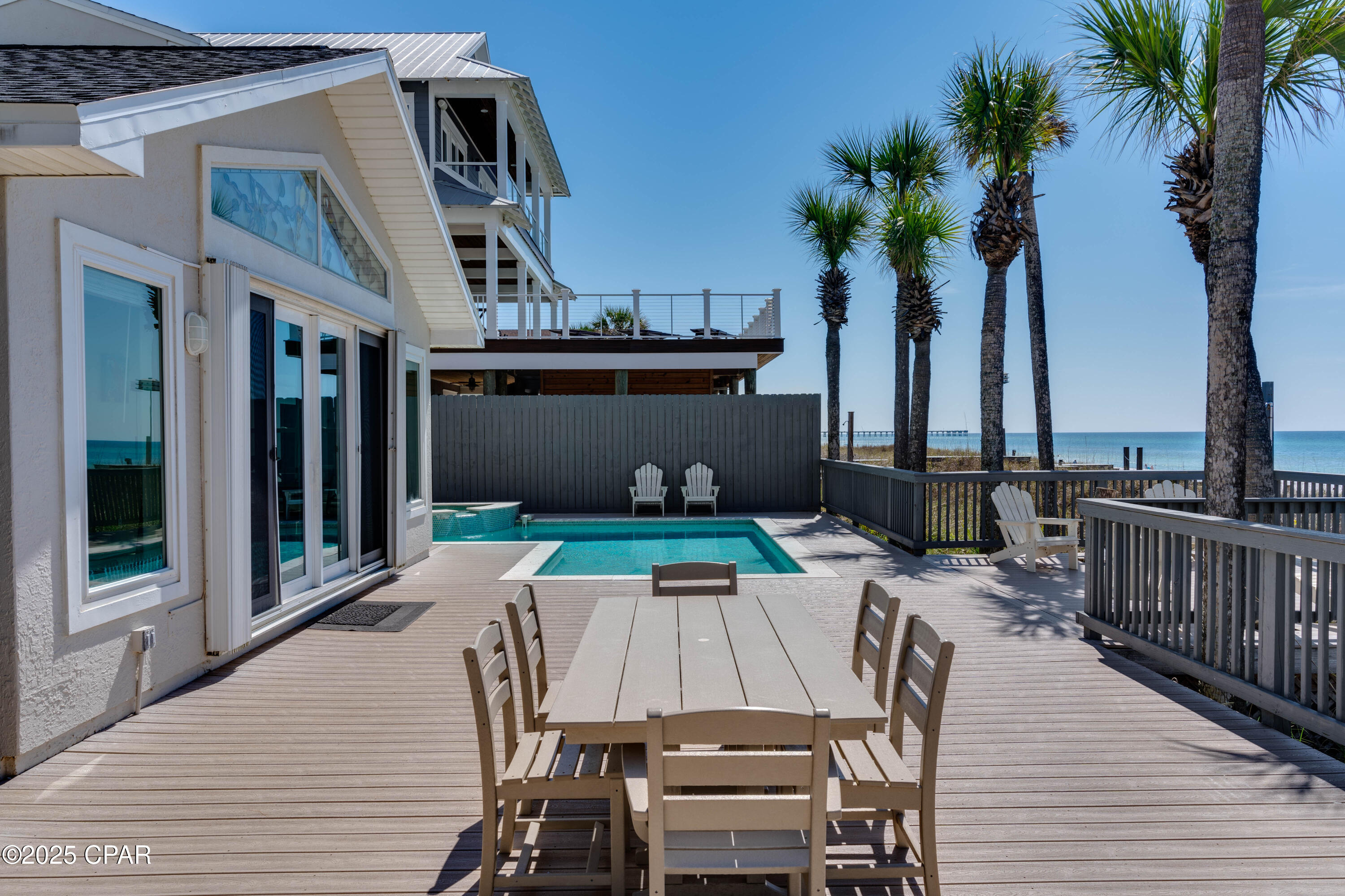 MAJOR PRICE IMPROVEMENT - NOW $3,000,000. A rare opportunity to own 60 feet of direct Gulf frontage in the heart of Panama City Beach.

Welcome to Parrotdise, a furnished, turnkey Gulf-front retreat offering the privacy of a residential beach street with the convenience of PCB's central location. Oleander Drive is tucked away from the constant traffic of Front Beach Road, yet places you within easy reach of both the east and west ends of the beach. Maggie Still Park, a charming neighborhood park, is just a short walk away.

The property offers 4 bedrooms, 4 full baths and more than 3,000 square feet of living space, including a flexible second-floor bonus room with its own kitchenette - ideal for extended family, guests, a bunk/game space or additional rental flexibility.

Outside is where this property earns its name. Step directly from the home into a private Gulf-front setting featuring an automated heated pool and spa, reinforced composite decking and unobstructed views across the emerald waters of the Gulf. With 60 feet of sandy beachfront, the backyard becomes the resort.

The home is offered furnished and includes features rarely found together in a central PCB beachfront property:

Two-car garage plus generous driveway parking
Private heated pool and spa
60 feet of direct Gulf frontage
Fully fenced yard with automatic privacy gate
400-amp electrical service
Dedicated 50-amp RV hookup
Luxury vinyl plank flooring on the main level
Custom tiled showers
Outdoor shower
Second-floor bonus room with kitchenette
No HOA
Short-term rentals permitted

Use it as a primary residence, private second home or vacation-rental property. The combination of direct beachfront, privacy, parking, pool, garage, flexible living space and central location creates a property that is increasingly difficult to duplicate along Panama City Beach.

At its newly repositioned price, 13211 Oleander Drive offers buyers the opportunity to secure a substantial Gulf-front home with garage space and 60 feet of beachfront without paying new-construction pricing.

Come see what $3 million buys on the Gulf.