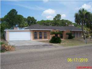 Great location for this 3 bedroom, 2 bath brick home. his home features a large living room with fireplace, formal dining room, large master bedroom with cedar sauna. Just a short walk to the Treasure Ship Marina and dining, and only a few blocks to the beach.