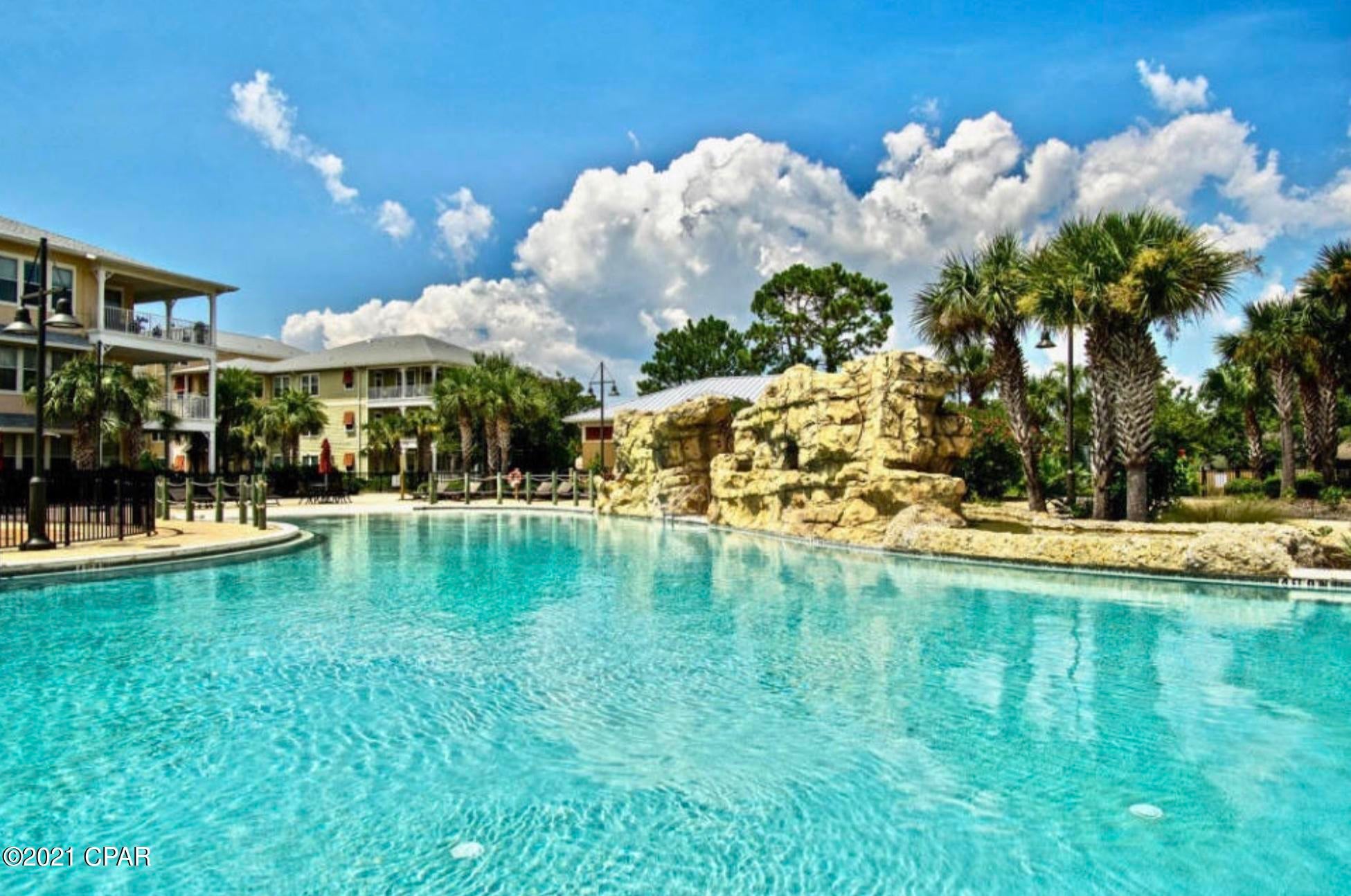 COMPLETELY FURNISHED VERY NICELY and in a resort style gated community.  Island Reserve has everything you would need for a laid back lifestyle with various amenities.  Beautiful waterfalls in an acre island pool, hot tub, game room, full gym, basketball, pickleball, and theater room.  Great place to get outdoors and walk around the beautifully landscaped courtyards.  This condo has two master bedrooms and is uniquely located overlooking a full courtyard area.  Drive up to second floor covered parking and just steps to the unit #1202.  You wont be disappointed!  Elevators too in all buildings.  NO SHORT TERM RENTALS.  ONE PET POLICY NOT TO EXCEED 40 LBS.  Better photos coming soon!