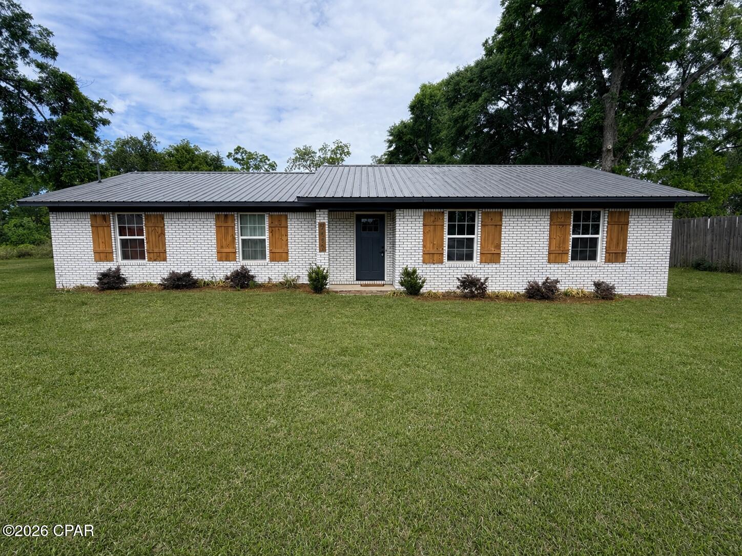 Completely updated and move-in ready, this 3 bedroom, 2 bath home offers 1,780 square feet of open living space designed for both comfort and functionality.

Step inside to a spacious open-concept living, dining, and kitchen area featuring new luxury vinyl plank flooring, updated lighting, and custom wood trim accents throughout that add warmth and character.

The kitchen is well-appointed with granite countertops, stainless steel appliances, ample cabinet space, and a large counter area that provides additional seating and workspace--perfect for entertaining or everyday living.

The floor plan offers privacy, with a generously sized primary suite and two additional bedrooms. Both bathrooms feature updated vanities with modern vessel sinks and fixtures.

Additional features include:
-New HVAC system
-New water heater
-Metal roof
-Dedicated laundry/mud room with extra storage space
-Sliding glass doors leading to the backyard
-Large open living area ideal for gatherings

Situated in Malone, this property offers a quiet setting while still being convenient to local amenities.