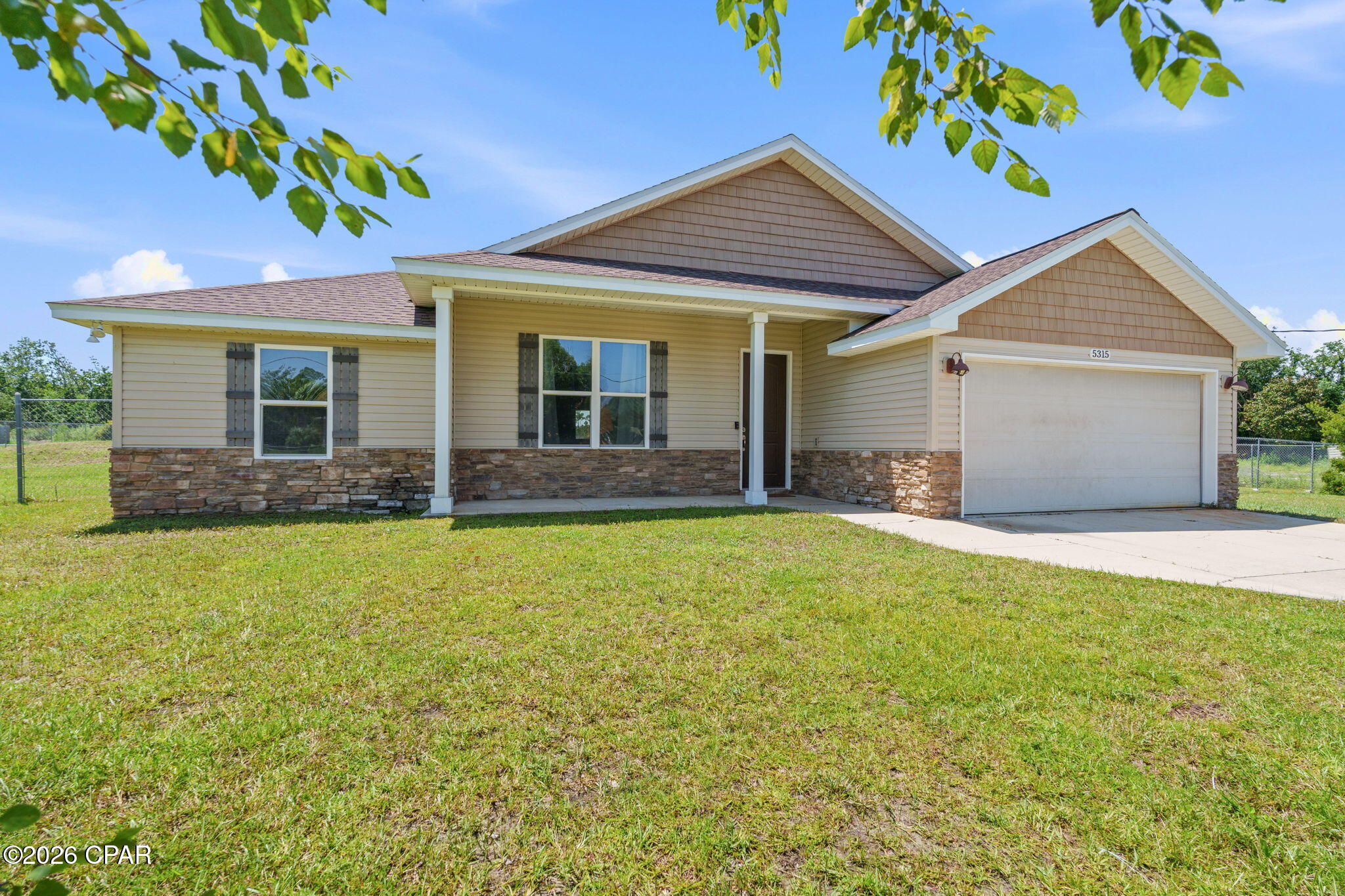 CURRENTLY UNDER CONTRACT, SELLER WILL CONSIDER BACKUP OFFERS Acreage, upgrades, and room to spread out! This beautiful newer home sits on over 1 acre and offers the perfect blend of modern finishes, thoughtful design, and plenty of space. The open-concept floor plan welcomes you with luxury solid vinyl plank flooring throughout the main living areas and an abundance of natural light.
The well-appointed kitchen features upgraded stainless steel appliances, granite countertops, pantry, and a breakfast bar with pendant lighting, making it both functional and perfect for entertaining. The spacious primary suite boasts a tray ceiling, walk-in closet, and ensuite bath with a double granite vanity.
A dedicated home office provides the ideal work-from-home setup with a built-in desk, granite countertop, and open shelving. Outside, enjoy charming stone and cedar shake accent, plus covered front and back porches that expand your living space and provide the perfect spot to relax. 
The property is equipped with a well, septic system, and irrigation system. The garage also features a 220V hookup, adding extra versatility for your workshop, equipment, or future projects. If you've been searching for a newer home with acreage, modern upgrades, and room to enjoy the Florida lifestyle, search no further!