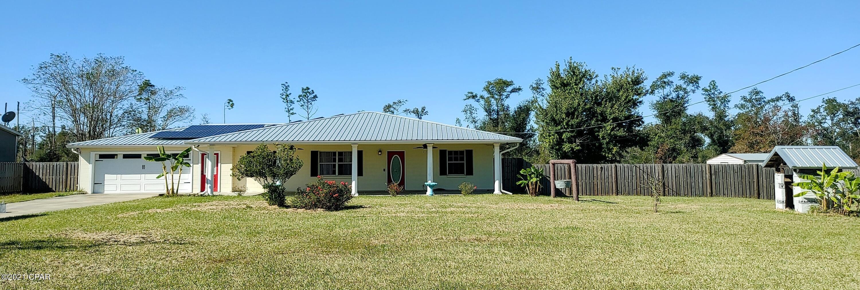 Updated unfurnished spacious 3 br 2 bath home with AC in garage that could be used for bonus room or work shop. Large front porch and covered back porch located  on a country setting of 1.30 acres.  Solar Panels on home to offer credit on your power bills.  Property sizes and measuerments are approximate.
