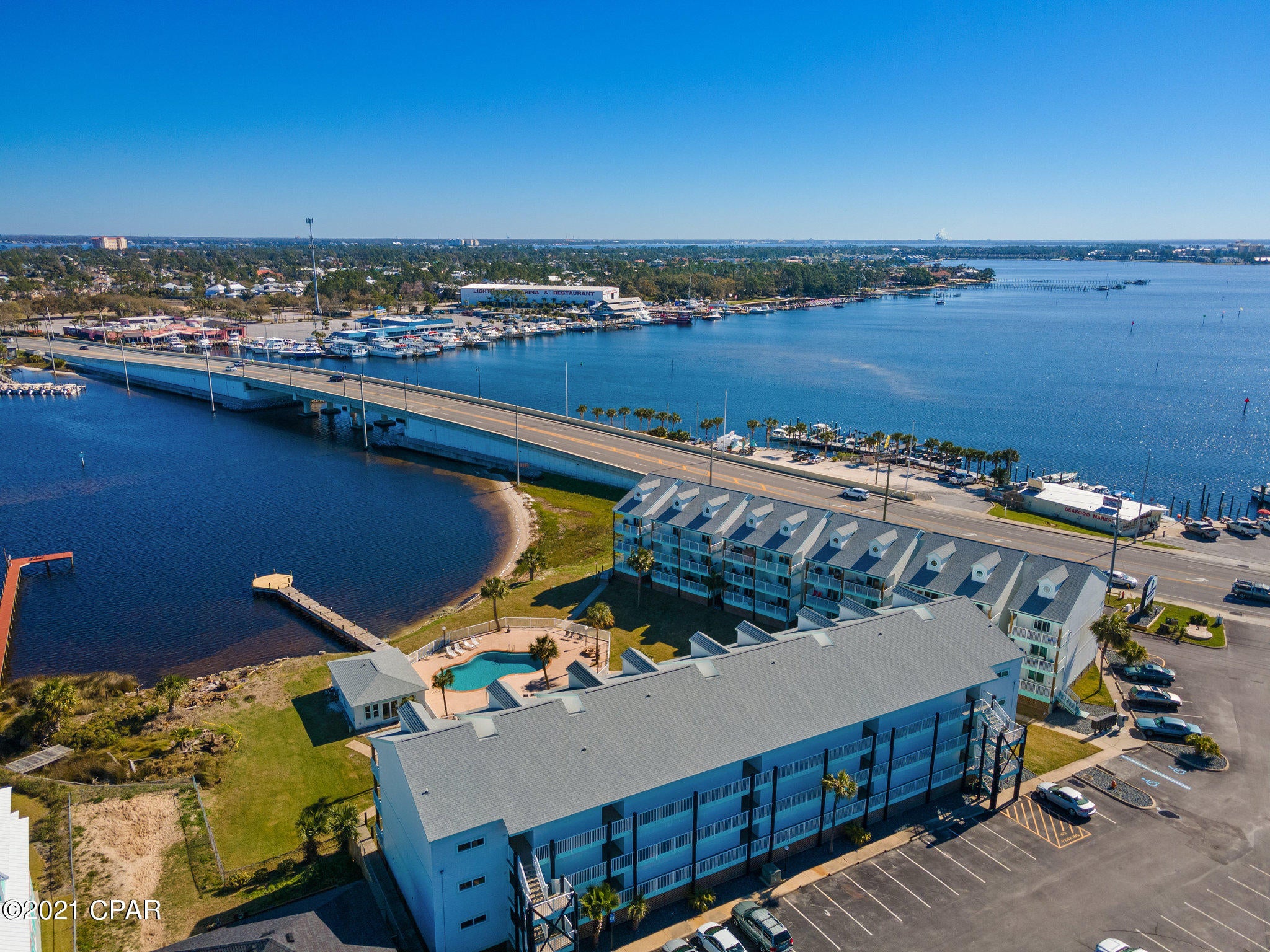CURRENTLY UNDER CONTRACT, SELLER ACCEPTING BACKUP OFFERS' Super cute condo with gorgeous views of Grand Lagoon. Enjoy your private balcony while watching the sights of the lagoon. The condo is cozy with a one bedroom and second sleeping area in the loft.