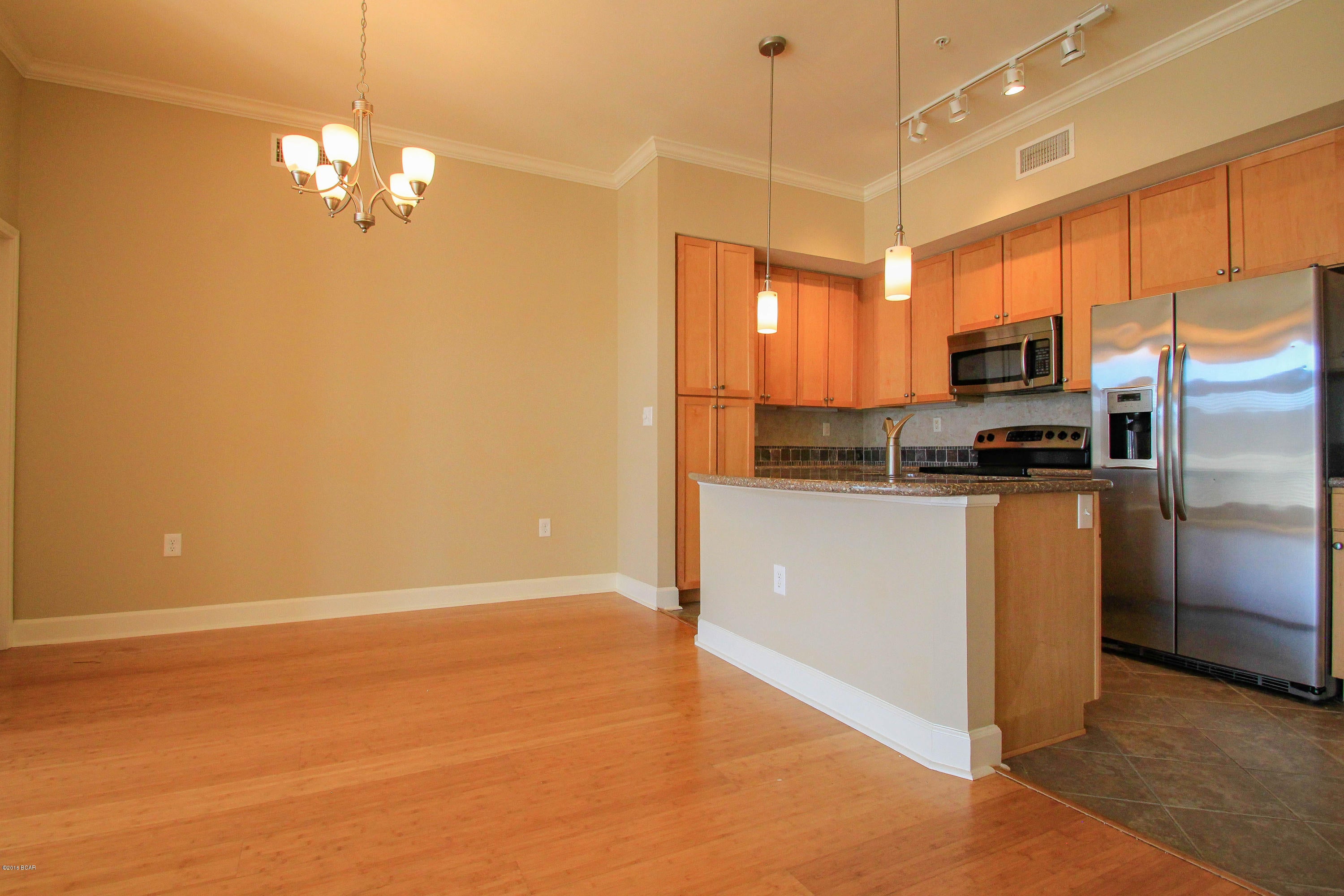 If Living in a Resort style Luxury condo near the Beach is your goal, then you have found the right Community to live in.  This Rental is clean, Open concept with Bamboo floors, 2 master Suites both with walk in closets. the grounds are Pristine, the amenities are top of the line with a 1 acre pool.  Security is a priority for the  Association who prides themselves on running the Best Gated Community for Resident only living.  No Vacation rentals allowed and the Rules and Regulations help keep this an upscale Community with great location just 1 mile from the Beach and very close to the Bridge giving anyone quick access over into Panama City, Lynn Haven, or Callaway.  Not only is the State of the Art Fitness Center included , so is Water, Sewer, Pest Control, Trash, Security, Maintenance
