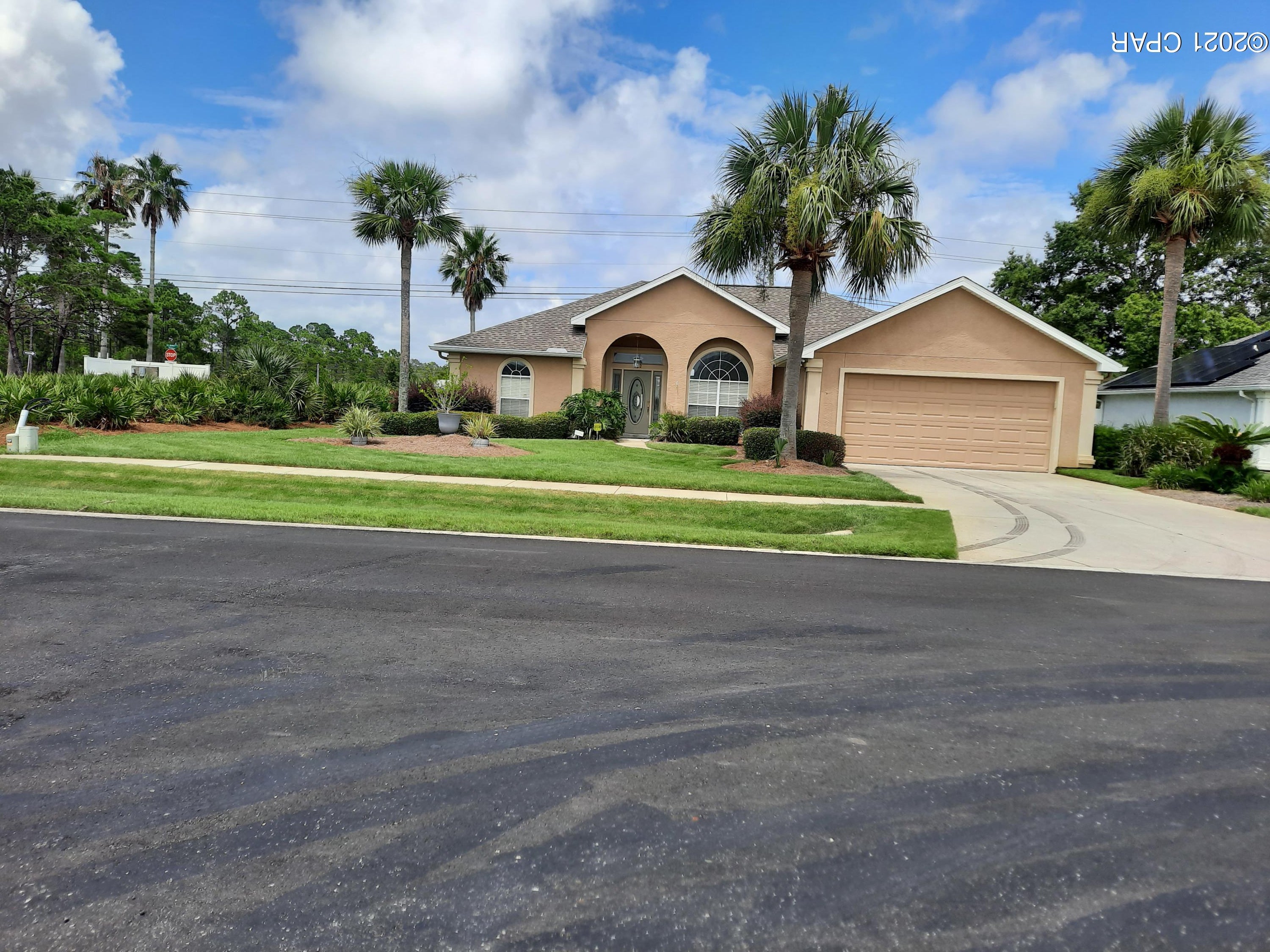 Must see custom home in the pristine Summerwood Community, one of the most  desirable neighborhoods on the Beach.  This is the home you've been looking for.   Situated on a landscaped corner lot, this home too many upgrades to list. The home has 3 bedrooms and 2 full baths, a gas fireplace in the living room, with beautiful new glass folding doors leading to the covered patio and a fully fenced backyard.  Home has a security system with surround sound throughout.   New roof and upgraded 6 inch gutters in 2019.   New 2017 HVAC system has been inspected and serviced 2ce per year.  Beautiful landscaping contains palm trees,manicured shrubbery, and much more.  Community pool and gazebo within walking distance.  Inside furnishings negotiable. OPEN HOUSE SUNDAY 07/11/2021, 12:00pm until 2:00pm