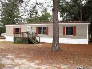 Beautiful corner lot surrounds this 1996 manufactured home that includes a yard building. The home features a large living room that overlooks the kitchen and adjoining dining area. The Master bedroom has an over-sized Master bath, and there are two good-size additional bedrooms. The home needs work and is being sold in its AS IS condition.