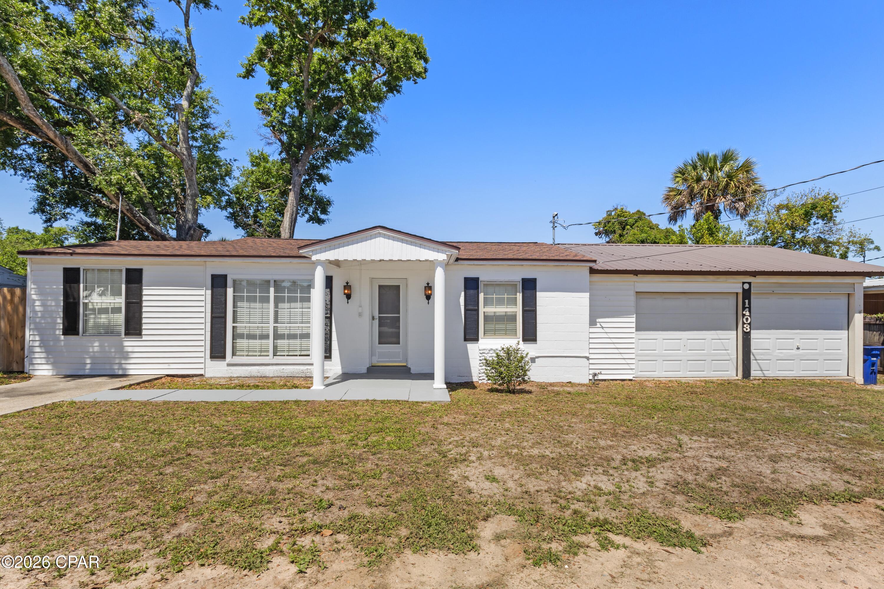 MOTIVATED SELLER!!!! This updated Florida cottage puts you right in the middle of everything people love about living in Panama City. With 3 bedrooms, 2 bathrooms, and a layout designed for everyday living as well as entertaining, this home offers the kind of space and functionality that's hard to find at this price point. Natural light fills the interior, highlighting the updated flooring, newer appliances, and the well-maintained condition throughout. Major improvements have already been taken care of, including the HVAC system, roof, and water heater, all which have been replaced within the last few years for added peace of mind. Outside, the home continues to impress with a screened-in patio, oversized deck, privacy-fenced backyard, and additional outdoor storage. The oversized true two-car garage provides plenty of room for vehicles, tools, beach gear, or hobbies. The street itself has recently been repaved and improved with new curbs and sidewalks adding to the overall appeal of the neighborhood. Location is one of the standout features here. This home is less than five minutes from Beach Drive and the public beach access at Calhoun Beach Park and just minutes from Historic St. Andrews and Downtown Panama City. You're also under 20 minutes from the white sandy beaches of the Gulf. Tyndall Air Force Base and the Navy Base are also both just a short drive away. Whether you're looking for a full-time residence, a second home near the water, or an investment opportunity with short-term rental potential, this property checks all the boxes for enjoying the Florida lifestyle year-round. If you like the neighborhood 1402 Arthur Ave across the street is also for sale.