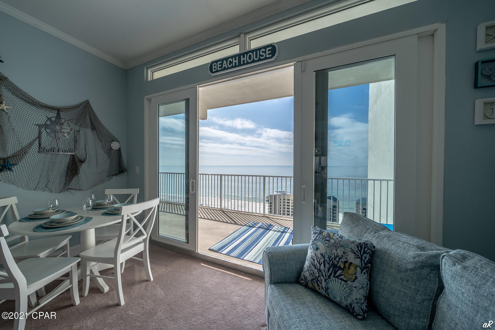 CURRENTLY UNDER CONTRACT, SELLER ACCEPTING BACKUP OFFERS  PENTHOUSE!!!! 10 ft ceilings with transom windows. Beautiful turn key 2 bed, 2 bath PLUS bunk room condo that sleeps 8 with GULF VIEWS, even sunsets!!!! Stunning CUSTOM MURAL in the bunk room. These are some of the largest units on PCB. New lighting, dishwasher, microwave, patio furniture, and water heater, washer/dryer. It is currently generating income and bookings will convey ready for you!!! The bedrooms are large. Main bath boasts large garden tub and walk-in shower. Amenities include 5 pools, 2 hot tubs, putting green, large fitness room overlooking the Gulf, light show nightly at 8pm. It's within walking distance to Walmart, shopping, Pineapple Willies, and 3 public beach accesses directly across the street. All measu