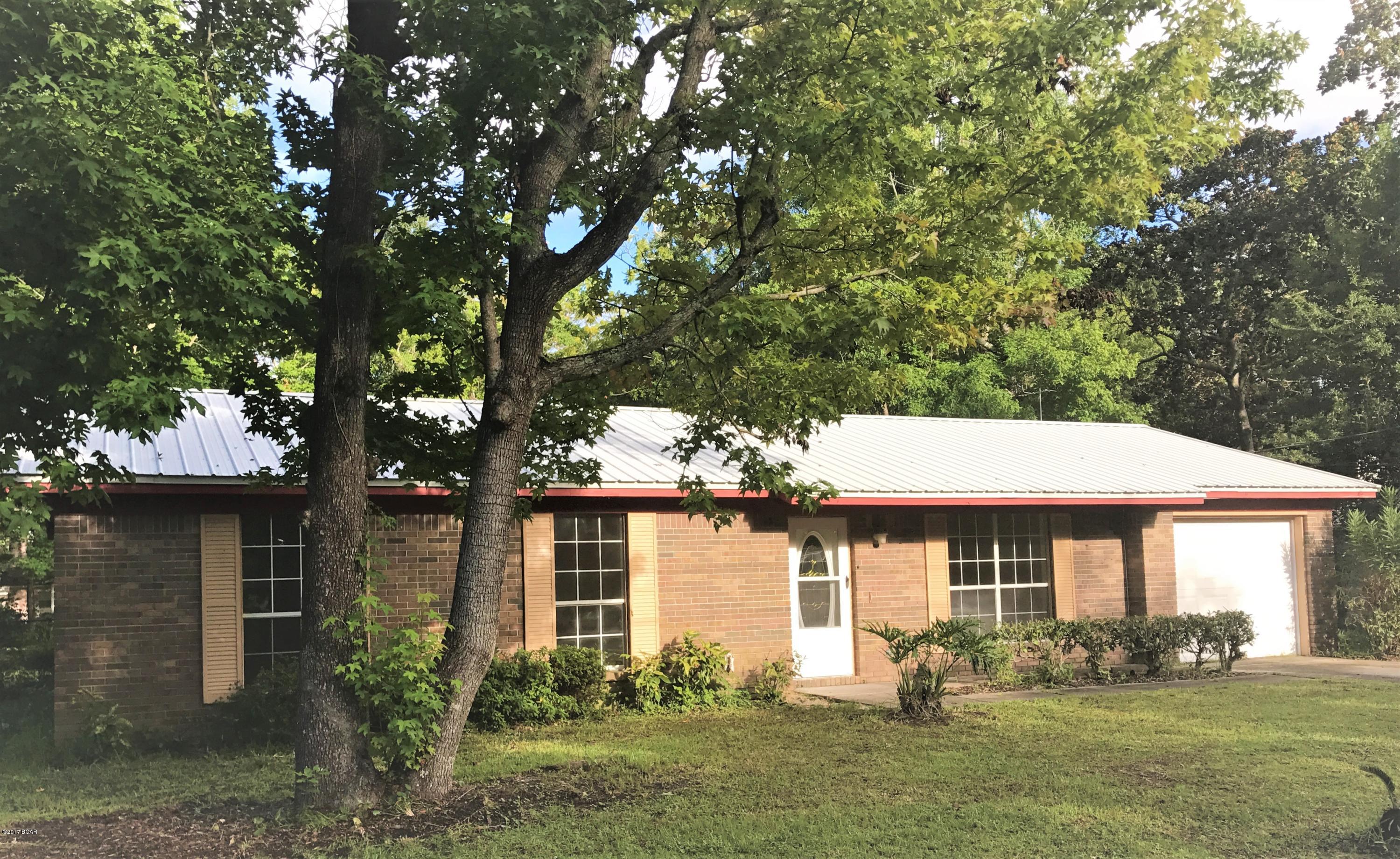 Ranch style brick home in Lynn Haven. Convenient to shopping, schools and dining. 3 bedrooms and 2 bathrooms and a separate dining area. The home sits on a  fenced lot with a one car garage. Lawn Care included March - Oct; tenant responsibility  Nov - Feb