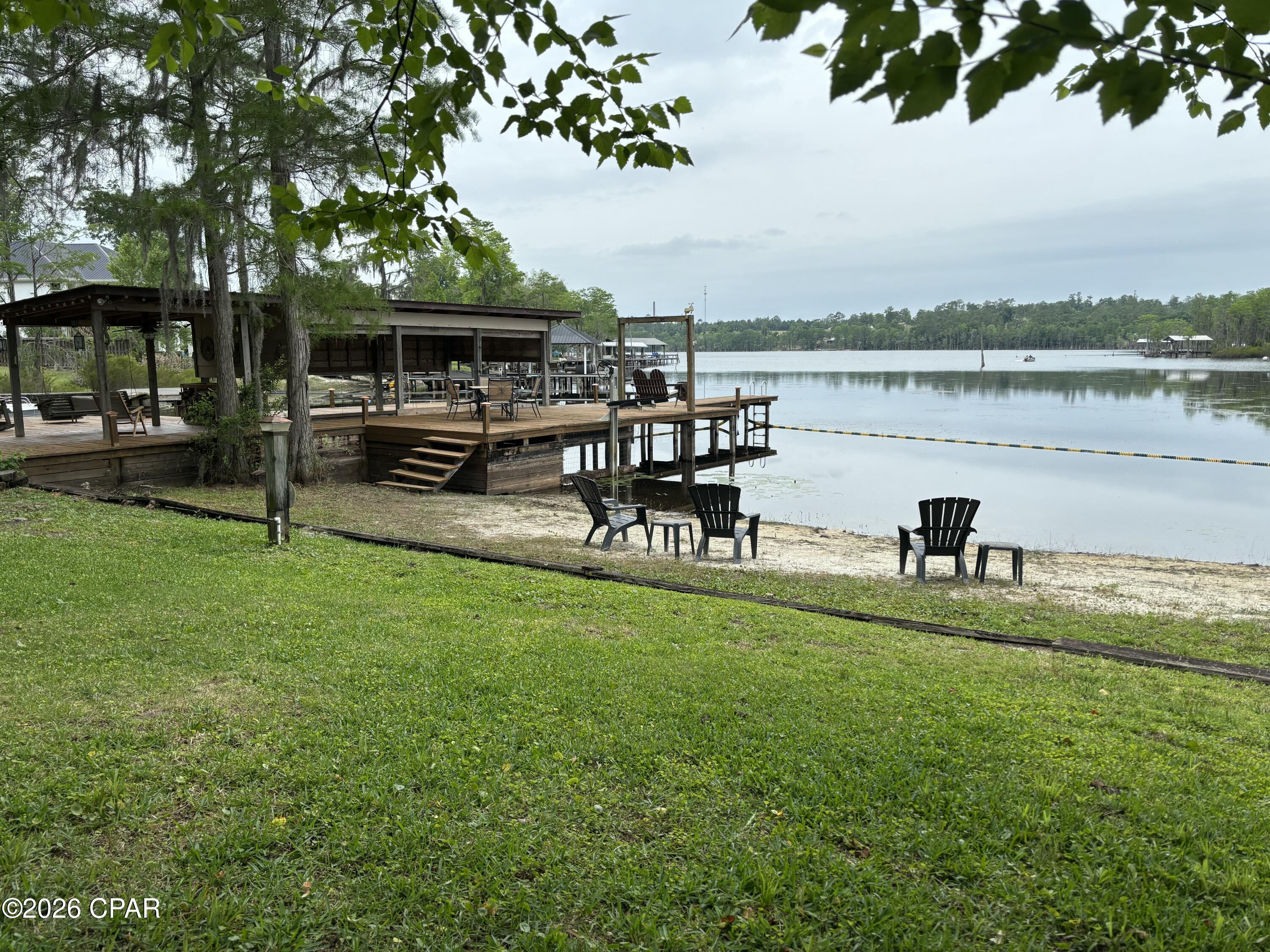 PRICE REDUCED!! This listing includes the waterfront home, a huge barn, and a guest house on 3 acres! The 2944sf barn - (Parcel ID-06-2N-11-0307-00B0-0060) & the 1 bed/ 1 bath cabin (address is 2677 Lakeview Circle- Parcel ID 06-2N-11-0000-0060-0012).

Welcome home to the highly desirable Compass Lake Community! This wonderful waterfront property is a MUST SEE! 

The waterfront home was tastefully renovated in 2019 with many upgrades such as the metal roof, HVAC system, storm windows & LVP flooring throughout. The stainless steel appliances were purchased in Dec of 2025, as well as a new water heater. The picture windows give you ample natural light throughout the home to enjoy gorgeous lake views from the primary suite, living room, den, dining room and the kitchen. You will love the oversized screened in upper deck that is perfect for entertaining! In the backyard you'll enjoy the large covered patio with plenty of space for outdoor living, along with an outdoor shower for your convenience after a day out on the lake.  The 300sf dock house with enclosed porch, 2 docks with a boat shed and a shared dock gives you more than enough room for your boats, jet ski's, and storage for your all of your lake supplies.  

The Barn has a large loft area and a full bathroom. There is room to store your boats, golf cart, jet skis, and even an RV!  Approx. 850sf of the barn is heated and cooled. There is an additional storage shed that is heated and cooled near the big barn.

The cabin was the original home on the water here, and has since been moved up the hill. Built in 1962, it has it's original charm, but includes several modern upgrades.  This adorable home would make a perfect Air B n B rental, or a wonderful guest house for family and friends. It has amazing views of the lake, and woods in the backyard so you are soaking in all of nature with an abundance of wildlife.  The cabin also has an outdoor shower and large screened in porch for taking in the scenery.
The home and cabin both have termite bonds, and there is a water filtration system on the deep water well.

The Compass Lake community has NO HOA but there is a public boat ramp for your use, and a Members Only boat ramp for those that join the boat club.  Homes on Compass Lake rarely are available for sale, as they are passed on through the generations.  This 700 acre spring fed & crystal clear lake is a great place to enjoy boating, skiing, wakeboarding, canoeing, paddleboarding, & fishing.  This quiet and picturesque community on Compass Lake is the perfect place to call home. If you love nature and the outdoors, then this is the home you've been looking for! 

 GO SEE this amazing property today!
 All measurements are approximate, please verify if important.