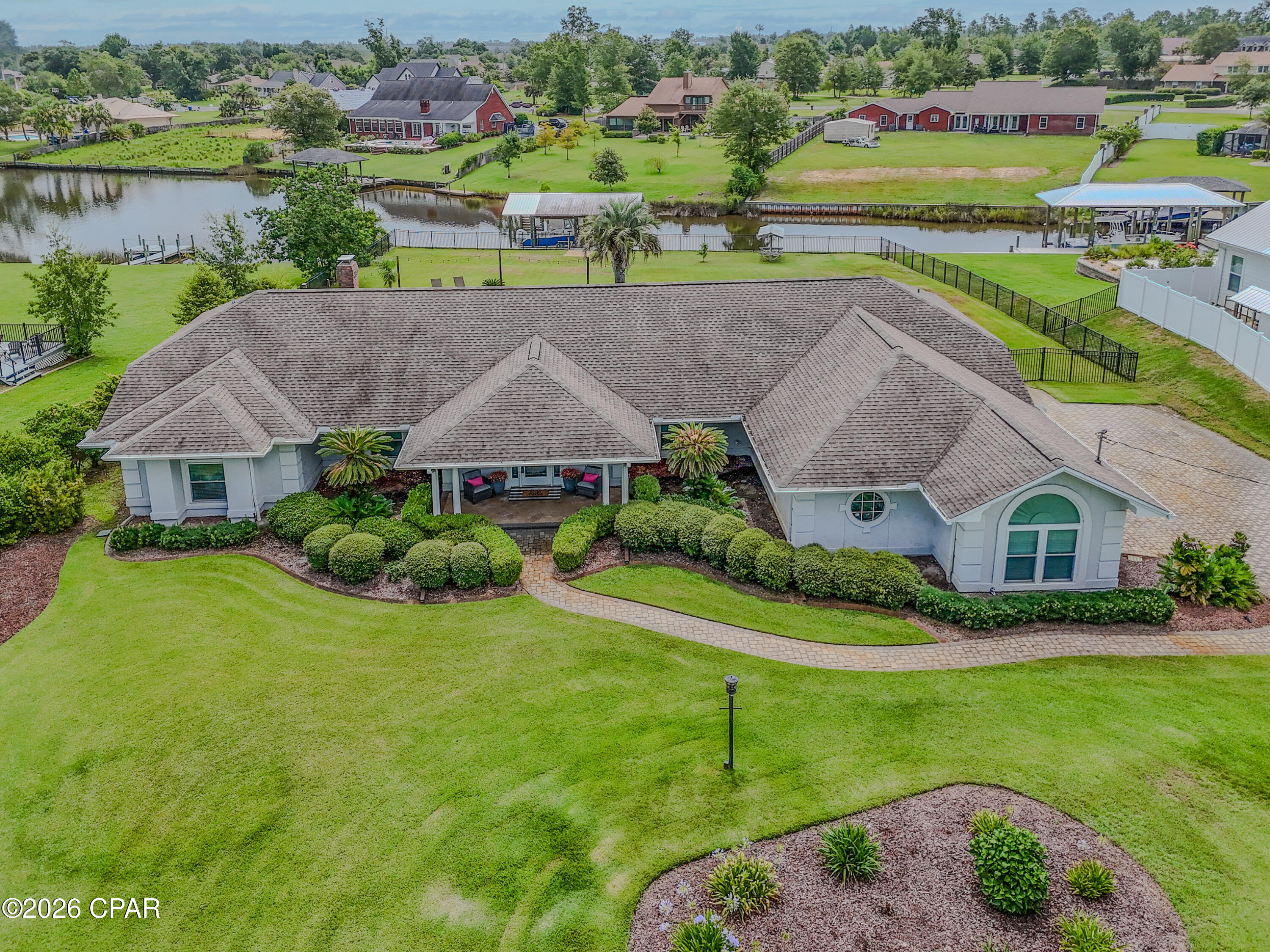 CURRENTLY UNDER CONTRACT, SELLER WILL CONSIDER BACKUP OFFERS-Welcome to your own waterfront paradise off of beautiful Mill Bayou, offering direct Gulf access and everything you need to enjoy the Florida boating lifestyle. Situated on over a half-acre, this exceptional 3-bedroom, 2-bath home features a private dock, boathouse, and boat lift capable of accommodating a 25-27-foot boat and an additional lift for a Waverunner-making it easy to enjoy endless days on the water. Inside, you'll love the spacious open floor plan designed for both everyday living and entertaining. The updated kitchen showcases stunning tile backsplash, ample cabinetry, and flows seamlessly into the expansive great room. Anchored by a cozy gas fireplace surrounded by picturesque white brick and custom built-in bookcases, the living space offers warmth, charm, and breathtaking views of the backyard through 3 sets of French Doors. The primary suite is a true retreat, featuring a peaceful sitting area with views of the water and pool, a generous walk-in closet, and a luxurious en suite bath complete with a beautifully tiled walk-in shower and classic clawfoot soaking tub.
Enjoy meals in the formal dining room or the sunny breakfast nook, where walls of windows overlook the sparkling saltwater pool and tranquil waterfront beyond.
Step outside to the large screened and covered patio, the perfect place to relax, entertain, or simply soak in Florida's year-round outdoor living. The oversized backyard is beautifully landscaped with lush green grass and a stunning saltwater pool surrounded by paver decking, creating a private oasis for family and friends. Completing this incredible property is a spacious two-car garage, abundant parking for vehicles, boats, and guests, plus a convenient 30-amp RV hookup. Whether you're boating, swimming, entertaining, or simply enjoying the peaceful waterfront setting, this exceptional home offers the perfect combination of luxury, comfort, and coastal living.