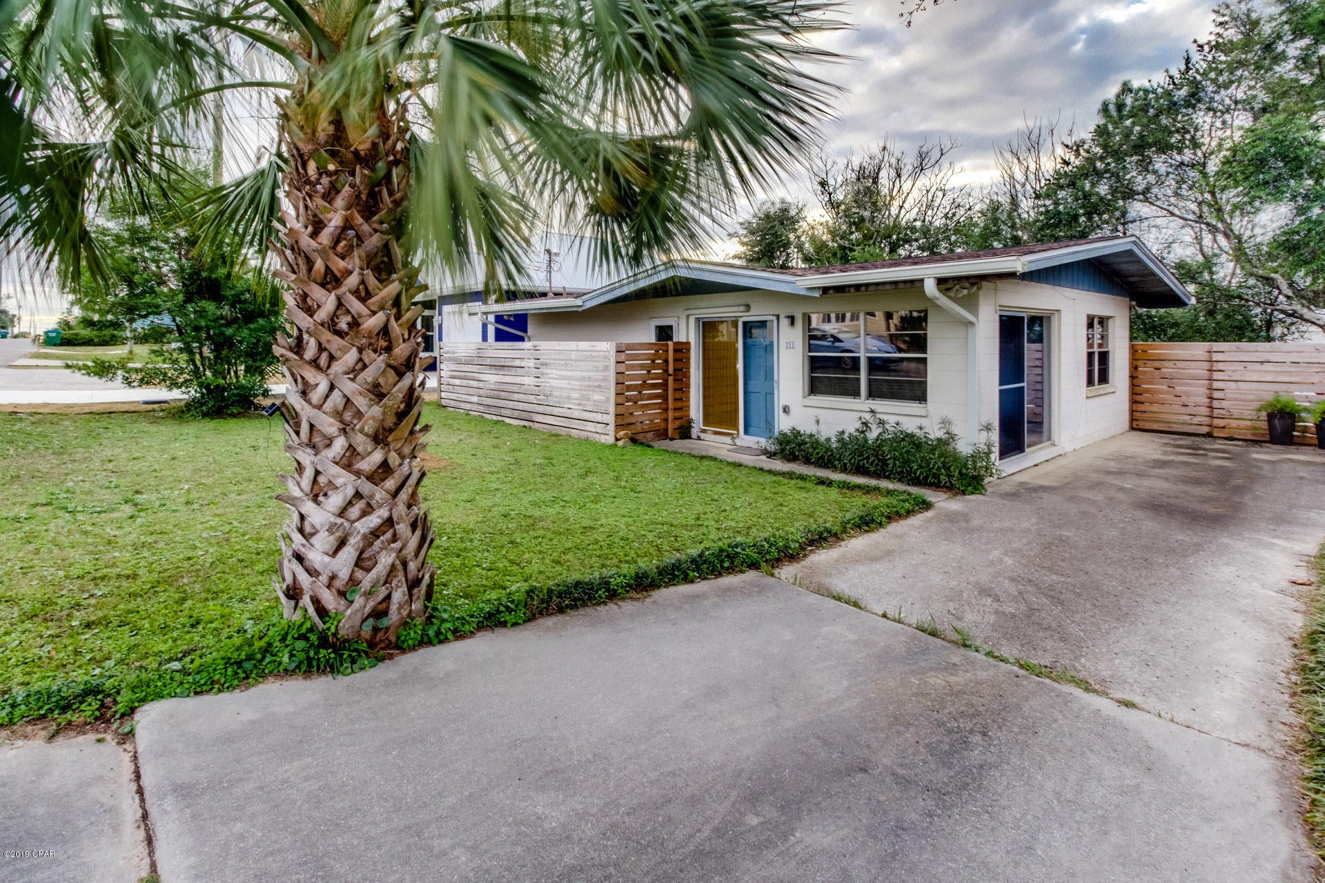 Well-pampered mid-century Florida cottage only 1.5 blocks from the Gulf. Authentic interior features soaring tongue and groove wood ceilings, terrazzo flooring,solid wood cabinetswith maple veneer, louvered doors, and original light fixtures. Modernization performed by Florida licensed contractors and replaced to Code.New architectural shingle roof,electrical panel, hot water heater, and HVAC, new smoke detectors, GIF outlets, motion activated flood lights and outside outlets, gutters and downspouts,window screens, UV/Hurricane coating on windows, pinch pleat custom drapes, sheers, child-safe 2'' blinds,6ft privacy fence, new utility door, Hotpoint fridge, tip-proof princess stove and vent. Great lawn front and back of home.Sun patio and extended driveway. Very stable neighborhood. Unrestricted Beach access absent any buildings/development on county maintained road from hwy 98 to Front Beach Road. Furnishings included in purchase price are Mid-century modern reproduction sofa, glass topped tulip table and Eiffel legged chair, Arc light and side chair, vintage furnitrue of solid wood twin headboards,dressers in Master and guest rooms. Solid wood wall mirror and circle mirror,Mid-century modern rose-beige sink bowl matching vintage tub, commode, and tile is ready for period-appropriate vanity to replace current contemporary wash stand. If you love Mid Century Modern designs solid-built construction features and want to be at the beach, dont miss this opportunity!