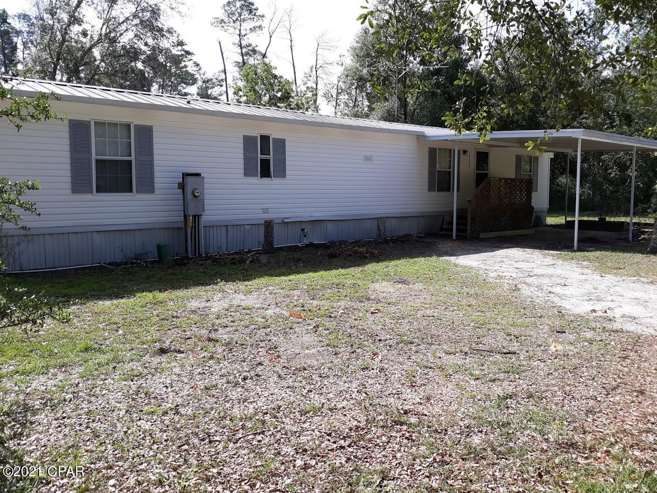 Neat & Clean and recently remodeled mobile home, open floor plan with good size rooms.  New paint, new tile flooring throughout (no carpet in home), equipped kitchen, large covered front patio, small covered back porch, private location directly off Hwy 77, gated driveway. Storage building in yard.   All electric home with central AC & heating.  This property is located behind a professional office building. (but not visible to the office or highway).  Broker/Owner.