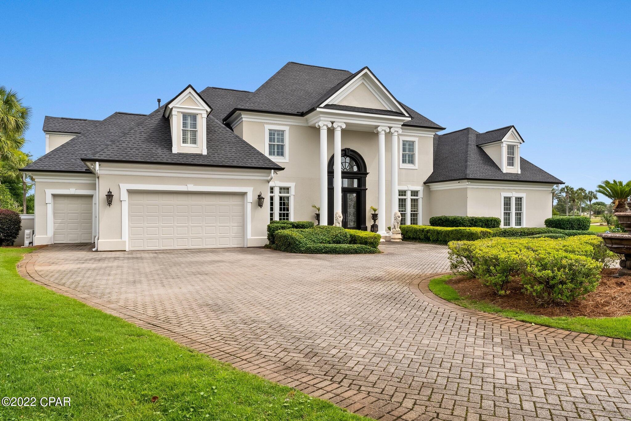 Nestled within the gates of the area's most desired neighborhood, this Legend Hills estate home is situated on a quiet Cul-de sac in the Fairways offering exceptional lakefront views while overlooking the renowned Bay Point Nicklaus Designed golf course. As you enter the front door, an architectural masterpiece awaits. This home provides over 5,500sf of living space and elegant finishes, including custom lighting, stone and hardwood floors, custom cabinetry, and a dramatic fireplace focal point. This is a bright and spacious home with high ceilings, custom crown molding and an abundance of natural light, is great for entertaining, with surround sound, built-in wine chiller, multiple indoor and outdoor dining areas, and a Chef Designed gourmet kitchen with high-end appliances, plus a full Butler's Pantry. Enjoy lake and Nicklaus course views along with amazing sunsets from your large pool deck. The first floor also includes a master wing, the master suite is elegantly designed and opulently appointed with generous square footage, incredible views through oversized windows, a separate sitting area, a luxurious ensuite, double boutique-style closets, as well as an additional bedroom. Three more bedrooms are located upstairs, along with a private office and without a doubt one of the most amazing playrooms that will delight all the kids regardless of age! 
The oversized climate controlled two-car garage features built-in storage and cabinetry and has a separate golf cart garage. It is perfect for all your adult toys! Just minutes from your door is the completely renovated  Bay Point Marina. This full service Marina is literally just minutes to the pass and can accommodate boats up to 130 feet! The Marina's proximity to the Gulf of Mexico and the Intracoastal Waterway make it a true paradise for boaters and fisherman and all those attracted to an elevated lifestyle on the water. All ages, SF and sizes are approximate.