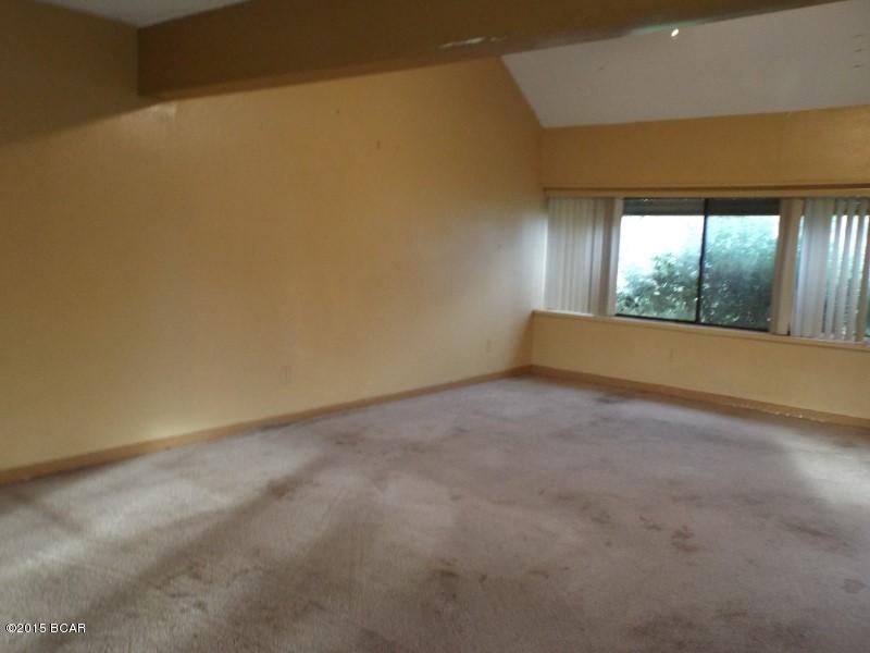 Large two story, three bedroom, two bathroom house with enclosed garage used as a bonus room on an acre lot with shed offered as is.  The property is on a paved road and is close to Eastern Ship yard and Tyndall Air Force Base.  All Sizes are approximate please verify accordingly.