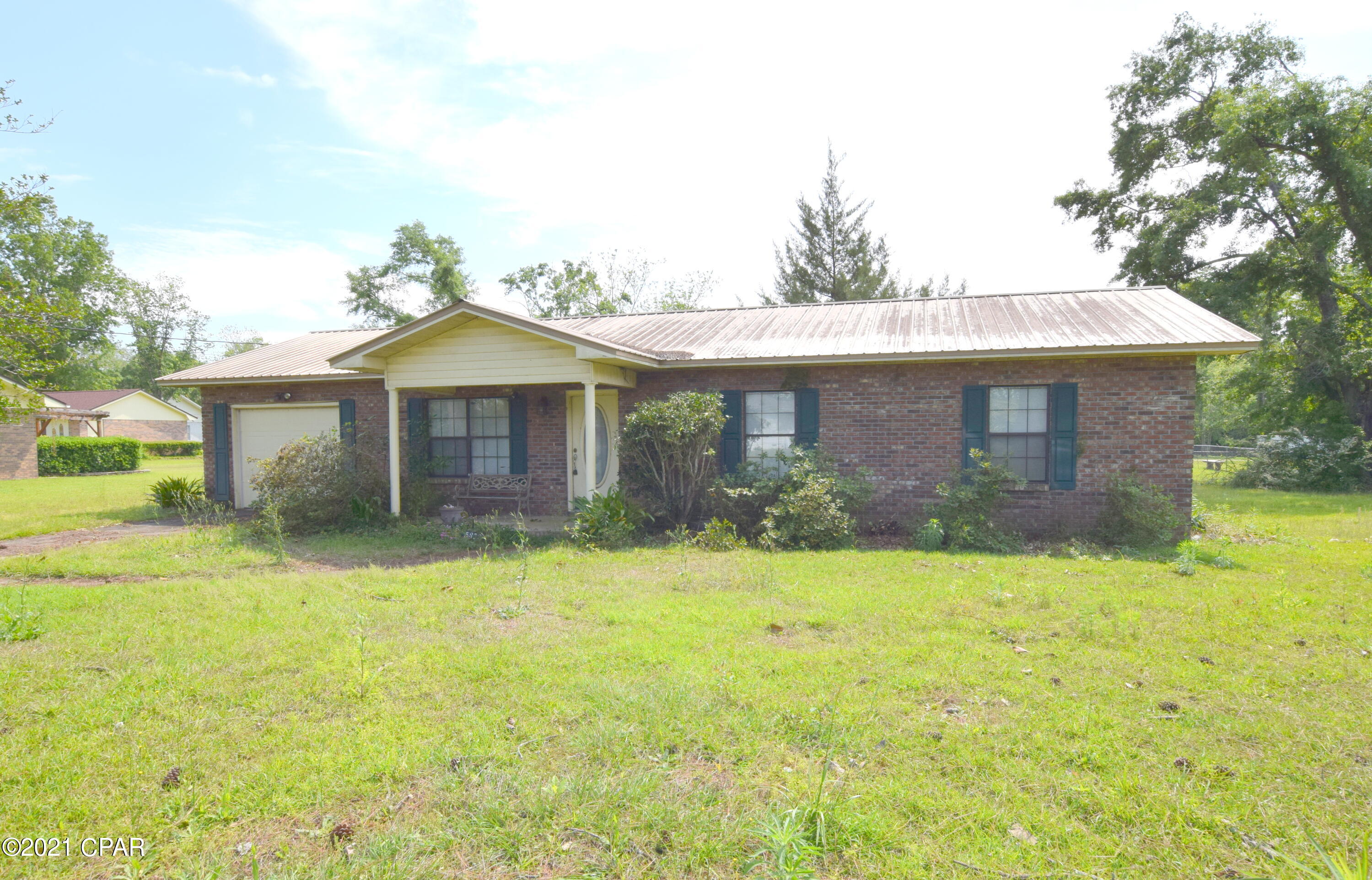 Nestled in the heart of Graceville sits this brick beauty! With some TLC this would make the perfect starter home or investment opportunity. Inside features include 3 bedrooms, 2 bath, open concept living/dining/kitchen, master boasting a full bath, oversized laundry room and an attached garage. Property is located in a quiet neighborhood close to the Baptist College of Florida and restaurants.