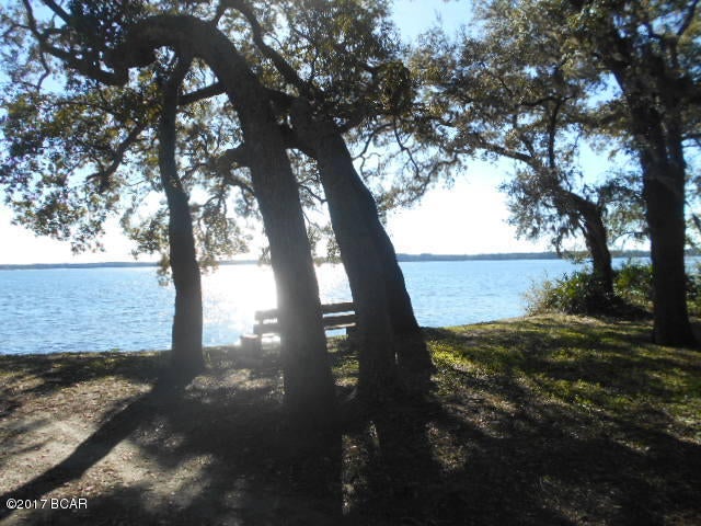 Beautiful lot with 174 feet of waterfront per recent survey! Deep water area! This lot has a spectacular view, gorgeous sunsets, and majestic oaks! This is one of the few areas with deep water access. The bulkhead is done. The lot widens out at the gorgeous waterfront! Sit and watch the panoramic sunsets from your private lot! Feel the breeze from the high bluff! Copy of survey is now available to potential approved buyers. Please verify all information.