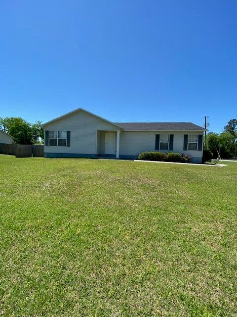Move In Ready!!  Very Nice 3/2 with a split floor plan, large living area and completely neutral colors throughout.  Nice size closets.  Ceiling fans, washer dryer, and nice corner lot.  Has cement walkway to front door and large parking area.  The backyard is chain link fenced> This place is immaculate inside and out.