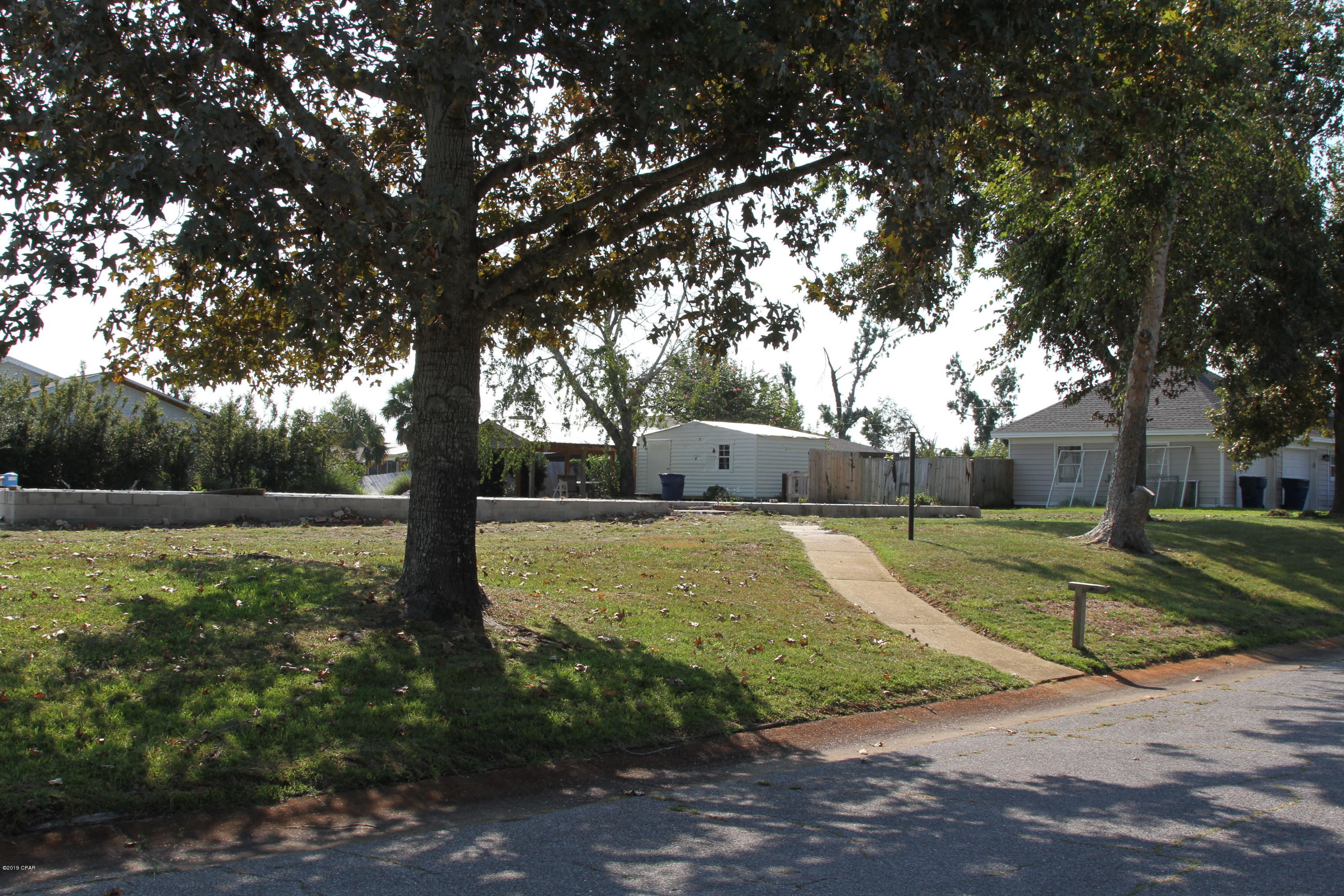 FOREST PARK RESIDENTIAL CORNER LOT.  Cleared accept for slab.  Includes well and pump, large storage shed (Contains storm damage but very usable and large pole barn with concrete slab.  Listing Agent is also the owner od the property.