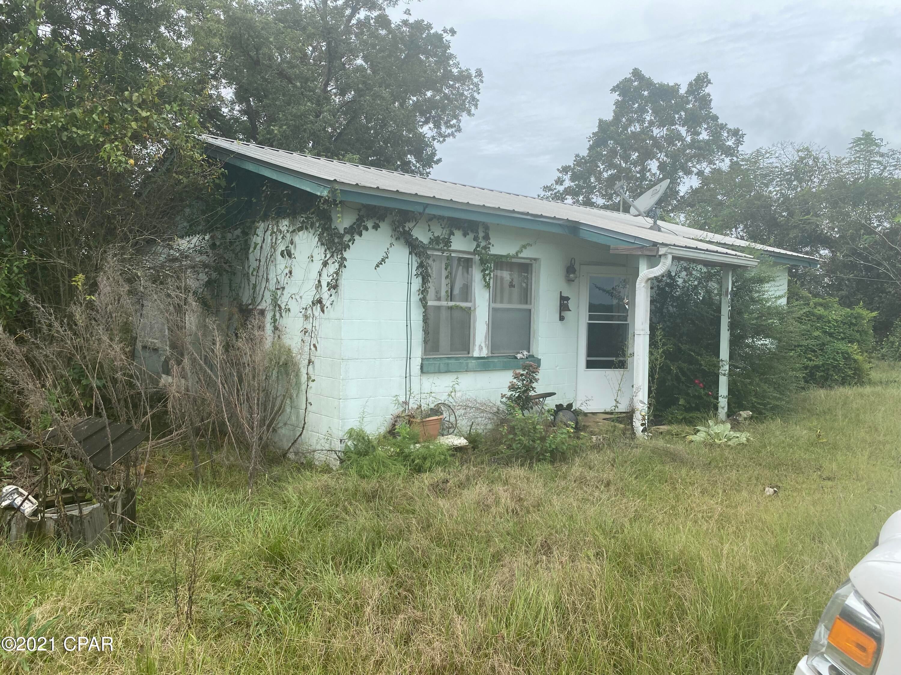 Two bedroom, one bathroom concrete block home that has sat vacant for years. The home sits on 2 acres on Old US road.