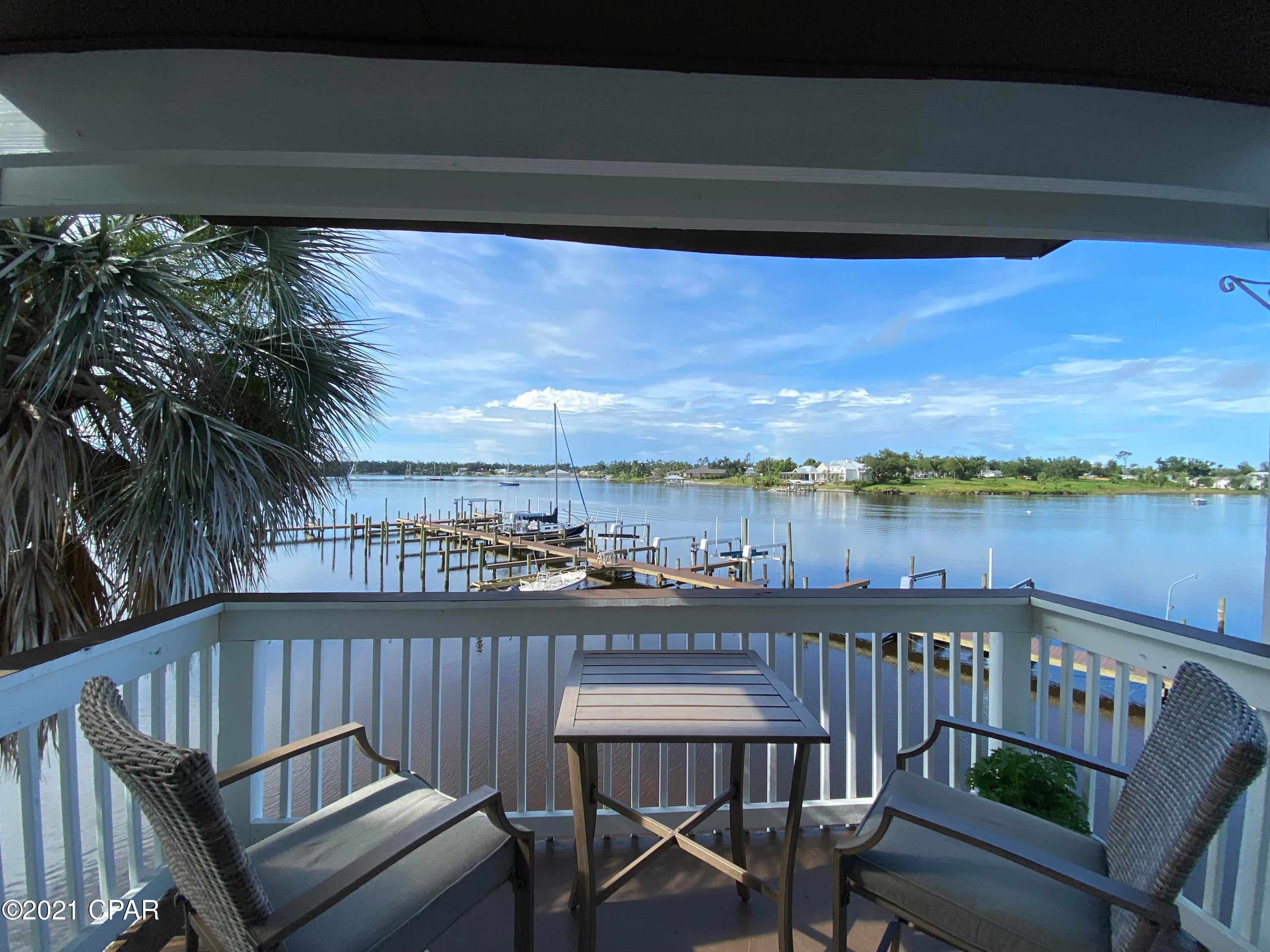 2BR/2BA water front condo with a 12' wide deeded boat slip! Newly renovated, this condo comes fully furnished and features all new: LVP flooring, stainless steel appliances, quartz counter tops, new cabinetry, W/D, HVAC system, hot water heater, lighting and paint.  The exterior has new: roof, storm doors/windows and paint. The dock has new: composite decking, lighting, electrical and water lines and some new pilings. The boat slip deeded to the condo is in deep waters at low tide.  Bayou Pointe Villas is located in the heart of PC in Watson Bayou, which is considered a hurricane hole.  With the Intercoastal waterway at your doorstep you have quick access to East Bay and the Gulf of Mexico. BPV is continuing to make improvements to the property.  The parking lot has been resurfaced and a new fence has been installed around the complex.  Secured gated entry coming soon!  Located walking distance to downtown PC, mins from St Andrews Bay, 7 miles from Tyndall AFB and 15 miles from Pier Park.  Short term rentals not allowed, buyer to verify all measurements.