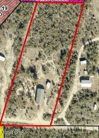 Looking for 2.5 Acres in a country setting this is it.  Property has been partially cleared and a damaged mobile home has been removed.
Well & Septic are on the property.  Property is  perfect to build or set up your manufactured home.  Let the serenity of this land become your new home site.
Buyer to verify lot dimensions; corners are marked.