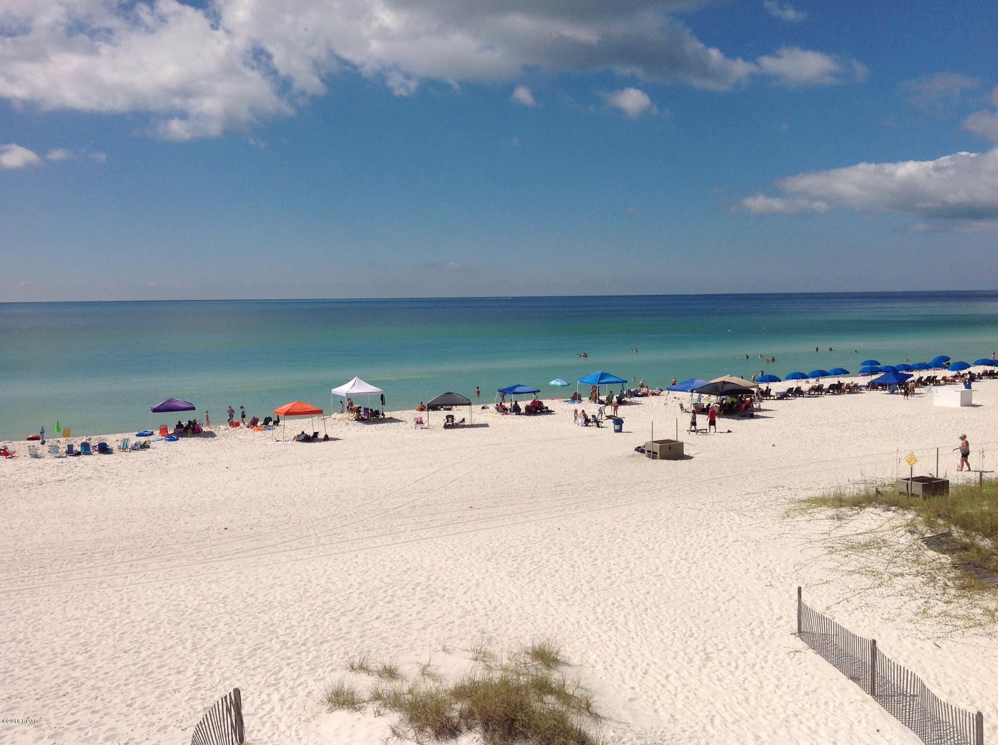 A perfect retreat and you can walk to  the beach with beach access, swimming pools, tennis courts, basketball courts and many other amenities. This condo has been updated with new carpet in the bedroom and laminate flooring in the living/dining area.  This unit has a full kitchen, bunks, a master bedroom, and an additional 1/2 bath.   The complex has beach access crosswalk.  Schedule your showing today.
