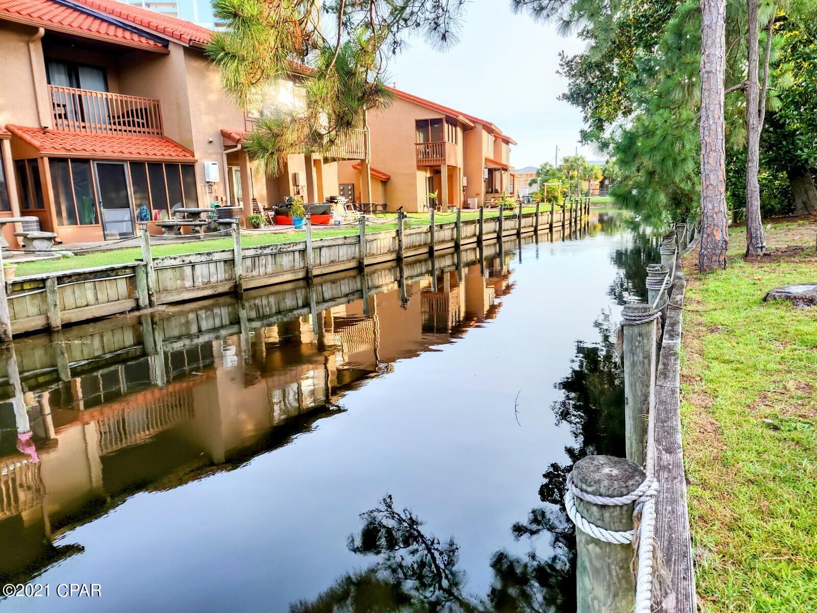 Gulf Highlands Beach Resort is a Gated Resort with 797 units located across the street from THE BEACH. This 2 BR has 2.5 Baths and backs up to the CANAL and is very close to the Beach Access. The Resort has 11 Pools (5 Seasonally Heated) and 1 Pool is Gulf Front with the Beach House & Snack Bar. There are 4 Tennis Courts, an 18 hole Mini Golf Course, HOA Dues are $700/qtr. These units are NOT Condos, so easy to get a loan on them. WALKING Distance to THE BEACH, Shopping, Dining, and Entertainment. Roof '2016, A/C '2021, 

WH '2012, Frig & Stove & DW & W&D all '2013.  Age, SF, and Dimensions are approximate... please verify if important.