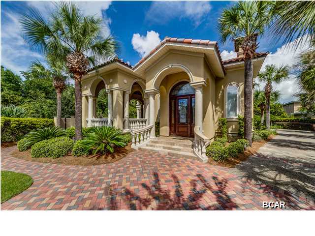Back on the market and new HVAC system for the main floor ($6,000) +$30,000 price reduction, Seller says it's time for someone to move in and enjoy this beautiful home. Custom built home in prestigious Finisterre. The details and quality of construction are incredible. Offering 3,081 square feet, 3 bedrooms, 2 and a half baths and all the outdoor living space you could possibly ask for. The home is wrapped around a beautiful courtyard pool and loggia and the flow is ideal for indoor/outdoor living. The loggia and dining pavilion provide over 500 square feet of covered outdoor patio space. The first floor has oak flooring in the living room, dining room and kitchen with 13' and 14' high ceilings, crown moulding and built-in sound system. The gourmet kitchen is huge and very functional with a large granite island and snack bar. The first floormaster bedroom suite has a poolside patio and luxurious bath. Upstairs there is a den with wet bar and balcony overlooking the pool. The two upstairs bedrooms are off of the den and share a bath. This home has to be seen to be appreciated. The pictures are wonderful, but the home is even more spectacular in person. Located in Finisterre, a gated waterfront community with tennis courts, playground and boat dock. Close to several marinas, the beach and St. Andrews State Park.