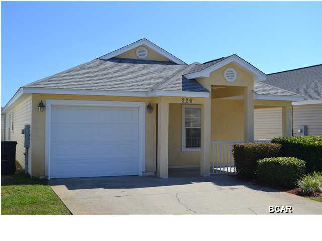 ******* JUST RENOVATED !!!!****** This fantastic 3 bedroom 2 bath home with a garage has just been renovated with new paint throughout, beautiful dark laminate flooring in the main living area and new carpet in all of the bedrooms. Palm Cove offers a great centralized location in the heart of Panama City Beach. You will never be bored in the active Palm Cove community which is located very close to the beautiful Gulf of Mexico. Palm Cove is a gated community with two community pools and even a volleyball court. Palm Cove association even covers your exterior yard maintenance. Don't miss this once in a lifetime opportunity to own your piece of paradise!!!. ALL ROOM SIZES AND DIMENSIONS ARE ESTIMATES, PLEASE VERIFY IF INPORTANT!