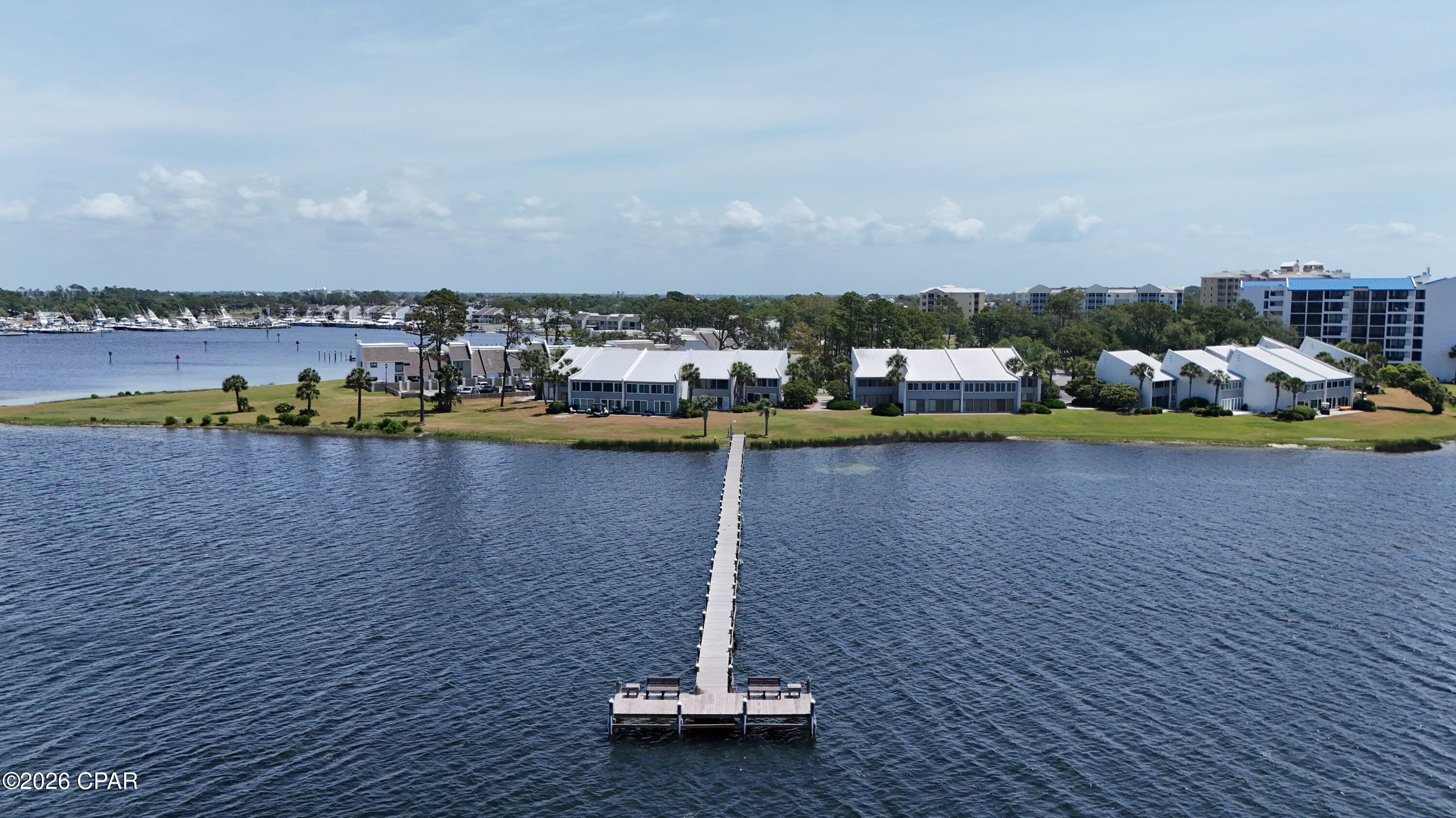 Bay Point Bayview Villa with sunset views.  This large one bedroom overlooks Grand Lagoon, marinas, and St Andrews State Park.  All floors have been updated to the LVP and match throughout.  The kitchen features new stainless appliances and new white cabinets.  Freshly painted with light neutral color.  Bavview has a community dock and boat trailer parking to use up to 10 days at a time, no long term storage.  Shared storage units provide additional space for storage and beach gear.  Complex is not required to have milestone, reserve study, or comply with new condo rules aimed at larger condos.  Located in the gated Bay Point  subdivion with roving secuirty.  Point South Marina, Jack Nicholas golf course, Bar 72, as well as Hilton resort are all contained withing the gates.  Neighborhood is golf cart friendly and a short drive or boat ride to the beach.