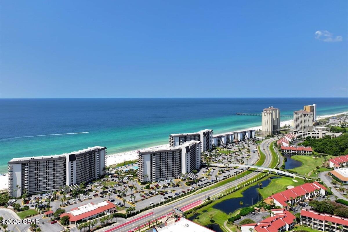 Experience resort-style living in this beautifully updated Edgewater Beach Resort Unit! This turnkey condo features stylish luxury vinyl plank flooring throughout, modern finishes, and a private balcony overlooking the resort's picturesque par-3 golf course--perfect for enjoying your morning coffee or unwinding after a day at the beach. Edgewater offers one of the most impressive amenity packages on the Gulf Coast, including 11 swimming pools, hot tubs, tennis and pickleball courts, a fitness center, on-site restaurants, market, kids club, splash pad, poolside cabanas, and a par-3 executive golf course. The resort also features direct beach access and is just one block from Shipwreck Island Waterpark, placing endless entertainment right at your doorstep. Whether you're looking for a vacation home, investment property, or full-time residence, Unit 2012 offers the perfect blend of comfort, convenience, and the ultimate beach resort lifestyle. Don't miss your opportunity to own a piece of paradise in one of Panama City Beach's premier gated resorts.
